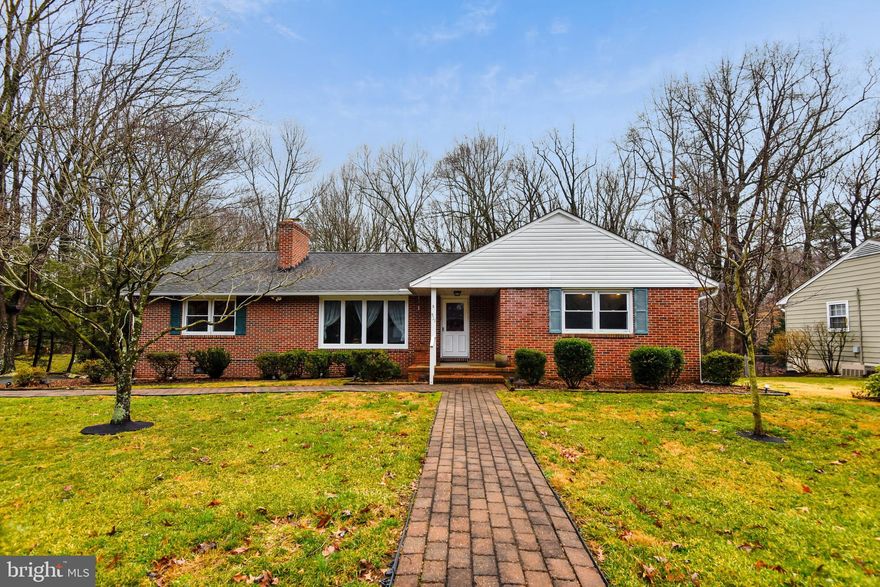 Here's your chance! Back on market. Buyers financing fell through.  Sought-after all brick rancher that backs to woods.  Great lot and location. Spacious bedrooms and a large eat-in kitchen.  4th bedroom could be used as a family room/home office. Hardwood floors. Walk out basement that leads to a patio and large screened-in porch where you can unwind, relax and enjoy your private back yard.  Finished lower level recreation room, plus an unfinished area with workbench and plenty of storage. This is a well-maintained home.   A few updates will make it shine.  Large shed.  Large, paved driveway.  Located on a street of custom homes in a community that feels private, yet is conveniently located near all major commuter routes, Anne Arundel Medical Center, shopping, downtown Annapolis and the Naval Academy.  Community elementary school. Open Sunday 8/2 - 11-1