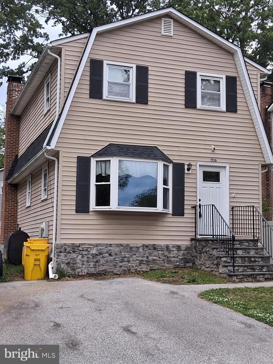 Beautiful Colonial with vinyl siding and stone front. 
Remodeled kitchen with top-of-the-line appliances.
Full brick wall, raised hearth fireplace in living room.
Solid Brazilian hardwood floors throughout the main level.
Vinyl fence and large storage shed in the back yard.
Plenty of off-street parking for three cars.
BONUS! Finished walk-out basement with rec room and den
 or 4th bedroom (no closet).