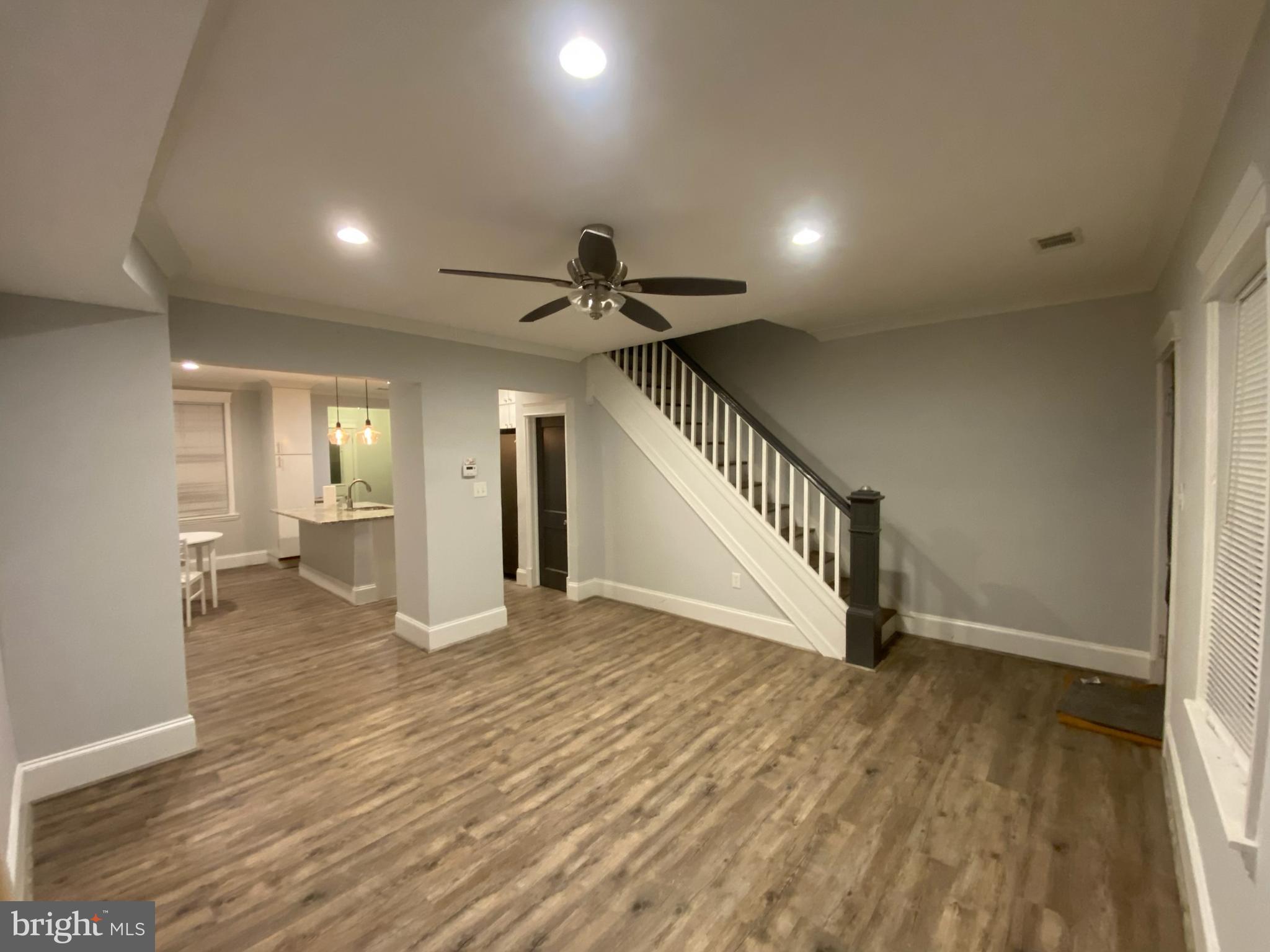 Remodeled attached row house with 3 br 1.1 ba, Gourmet kitchen with granite counter tops, island with seating, table space kitchen, Living room with crown molding, recessed lights, HWF throughout, Full bath with skylight, Fenced rear, parking pad for 2 cars, Front porch, new windows, New roof. Ready for you to make this your home.