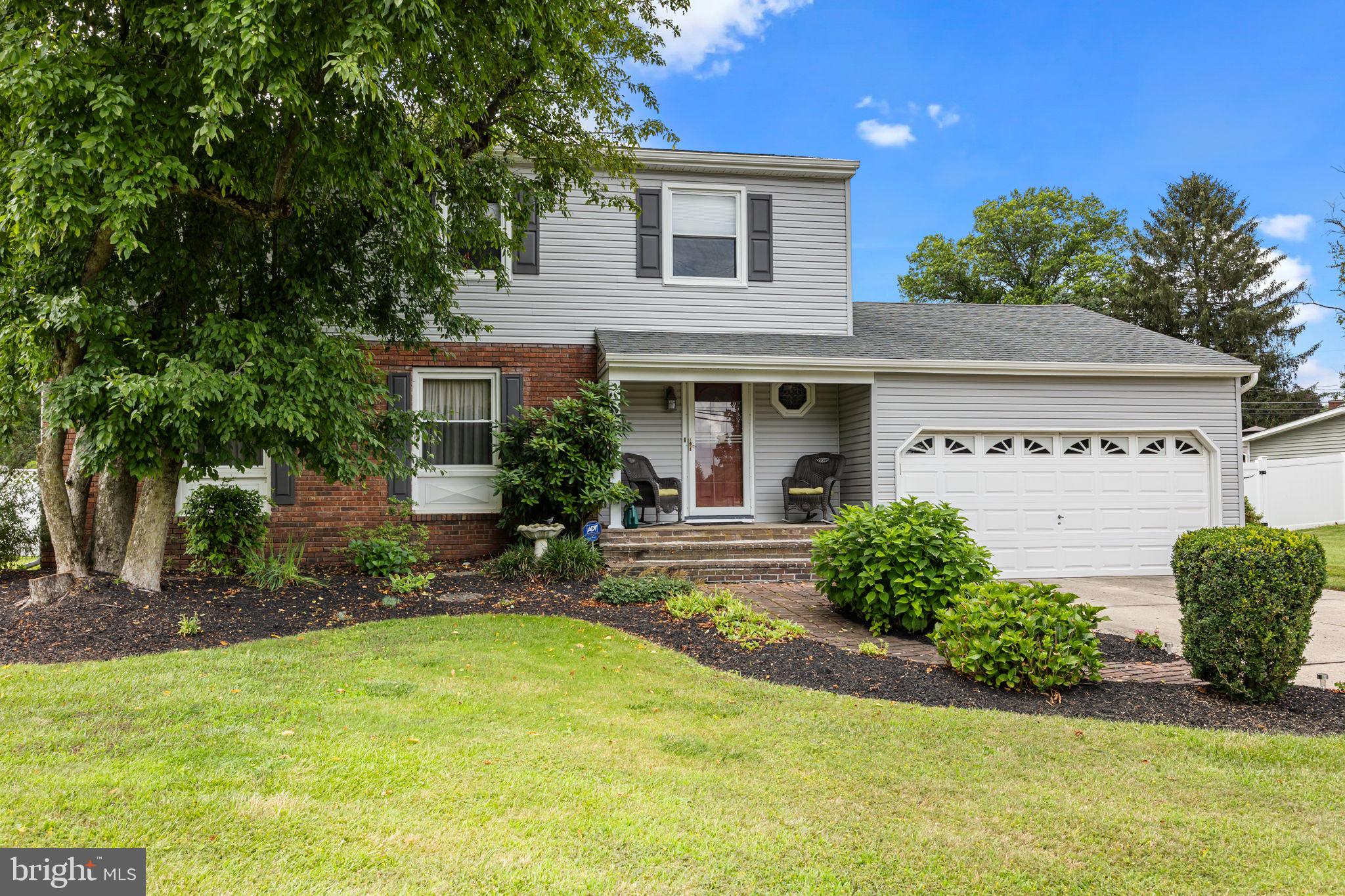 Great Curb Appeal! This spacious 5-bedroom, 2.5-bath Colonial is located in a desirable Grade A neighborhood and offers everything today's buyer is looking for. Features include a full basement, two-car garage, and beautifully maintained hardwood floors throughout. The inviting family room boasts a wood-burning fireplace with a stylish decorative tile surround—perfect for cozy nights in. Enjoy cooking in the updated kitchen with rich wood cabinetry, granite countertops, tiled backsplash, and stainless-steel appliances. Additional highlights include decorative molding, a sunroom with sliding doors leading to a maintenance-free composite deck, and a convenient laundry room. The home’s lower level offers a finished recreation room and plenty of additional storage space. Updated bathrooms, a fenced-in parklike yard, and a brand-new roof (2024) add tremendous value. All this, just minutes from Route 1, I-95, Route 13, NJ bridges, shopping, dining, and more.