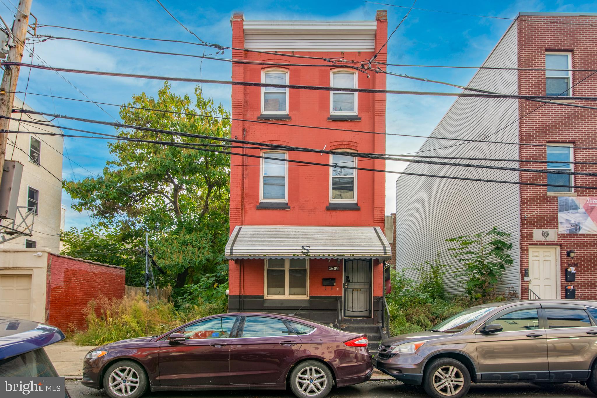 Welcome home to this recently renovated 6 bedroom, 2½ bathroom townhome located steps away from Temple University AND has central air conditioning! Live in the home yourself or rent it to Temple students with ease. The living room is spacious, bright, has gorgeous engineered wood flooring, recessed lighting and offers an open concept straight through to your kitchen. The kitchen is equipped with a built in microwave, fridge, gas range and neutral cabinetry. The first floor also offers a powder room along with a washer / dryer room. .The second floor offers 3 additional spacious bedrooms with beautiful flooring, and a full hallway bathroom with tub / shower combination. Head up to the third floor to another 3 bedrooms and a full hallway bathroom also with tub / shower combination. Your backyard is spacious and private - the perfect place for summertime entertaining. The basement is awaiting your finishing touches! This property screams location, location, location and provides for easy public transportation, great walkability and access to all major routes. Schedule your showing today! Property is currently rented for $3350 / month through 7/31/2026