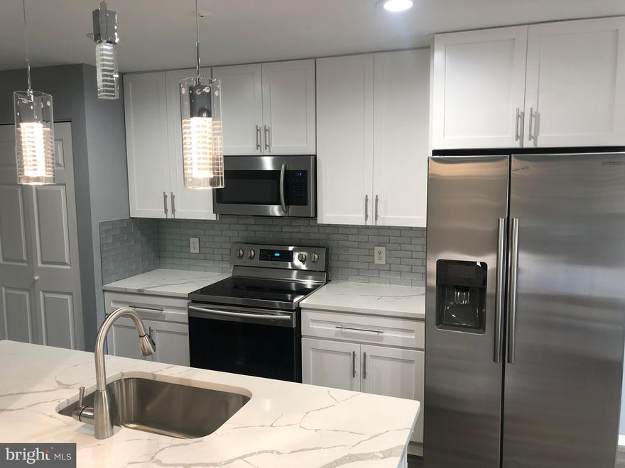 Completely renovated with laundry in unit.  Beautiful kitchen with stainless steel appliances, soft close cabinets and quartz countertops.  Brand new floors, open floor plan and walk out back patio.  Large bedroom with double closets.  2nd room provides plenty of storage or can even be a home office.  Large full bathroom with new vanity and fixtures.  1 assigned parking spot included with the rent.  LANDLORD WILL REDUCE THE RENT TO 1400 WITH A 15 OR 18 MONTH RENT!!