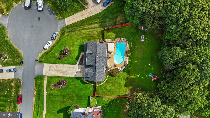 Price reduction! SWIMMING POOL!!! New carpets  installed upstairs. Located on three quarters of an  acre on a quiet cul-de-sac with NO HOA, this  well-maintained property offers flexible living spaces, abundant updates, and amazing outdoor features.
Upstairs, you’ll find four generously sized bedrooms and two full bathrooms, including a luxurious primary suite with cathedral ceilings, two walk-in closets and its own fireplace.
The main level features formal living and dining rooms, a powder room, and a large eat-in kitchen adjoining  the family room—complete with a second fireplace. 
The lower level has a fully independent living space with private entrance, its own kitchen, bedroom, full bathroom, laundry, and walk-out access to the patio and pool. Ideal for an in-law suite, rental unit, or multi-generational living.
Outdoor living is where this home truly shines! Step out from the family room to a spacious deck—perfect for morning coffee or evening entertaining.  From there, head down to the fenced backyard and relax poolside on those hot summer days.
Major updates include:
Roof (2018)
HVAC system (2018)
Water heater (2025)
Security system with cameras