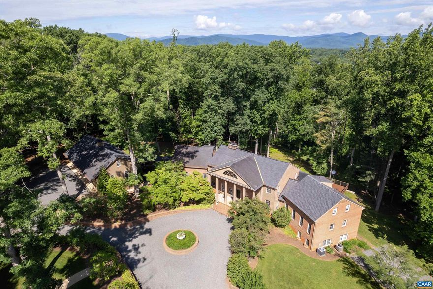 Idyllic country estate bordered by Mechums River with spectacular Blue Ridge views. 7 miles to Barracks Rd shopping and 12 miles to Charlottesville and the University of Virginia. Complete with 8,575� square foot primary residence, pool, 5-car garage, 3-bedroom cottage, 6-stall stable with living accommodations, trailer shed, equipment barn/shop and several run-in sheds. The 7 bedroom home is overlooks the pool, Mechums River, and mountains. Built in 1973, and thoroughly renovated in 2019 with the highest quality materials and excellent craftsmanship, the main residence is comfortable, spacious, and nicely appointed. The property is complemented by lovely gardens, stone walls and mature trees leading to the equestrian facilities and other necessary horse facilities. 7 miles to Barracks Rd shopping and 12 miles to Charlottesville and the University of Virginia.