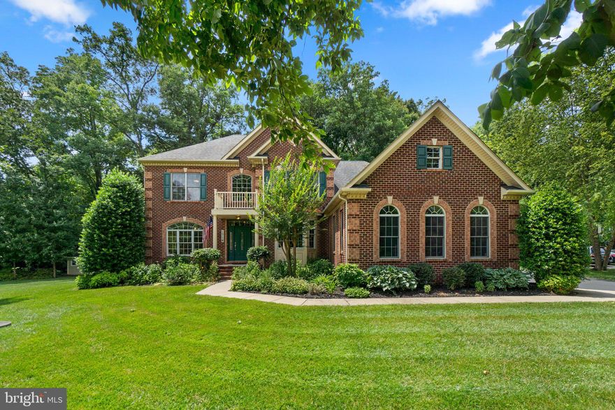 Welcome to this gorgeous 4-bedroom home, featuring a welcoming two-story foyer with stately columns. The beautiful, spacious kitchen is a dream with a double sink, granite countertops, detailed tile backsplash, a large center island with bar-height seating, and a six burner gas cooktop. Adjacent is a breakfast area with a French door leading to an expansive bi-level deck. The open concept floor plan flows into the family room with a  50 inch fireplace, perfect for gatherings.


This home also boasts a separate formal dining room and living room, both with tray ceilings and detailed wood moldings and a main level laundry and full bath! There is a versatile home office on the main level that could also serve as an additional bedroom, featuring a French door that opens to the deck. Hardwood floors and crown molding are present throughout most of the main level, enhancing the elegance.


Two staircases lead to the upper level with four generously sized bedrooms. The expansive owner's suite impresses with a tray ceiling, a huge closet, and an ensuite bathroom with two vanities, a large soaking tub, and a separate shower. Two of the bedrooms share a Jack and Jill bathroom, while the fourth bedroom has its own private bath.


The spacious finished lower level is designed for entertainment, with an additional family room featuring built-in shelving, a propane gas fireplace, a well-equipped wet bar, recessed lighting, and two additional rooms perfect for exercise, a second home office, or a playroom. Another full bathroom and French doors leading to the back yard  complete this level.


Outdoor features include an expansive deck, a stone fire pit/patio area with a stone wall for seating, a shed, and a large secluded yard with mature landscaping and trees. This home offers lots of natural light, new carpet, and a 3-car garage! Located on a quiet cul-de-sac, this home truly has it all!