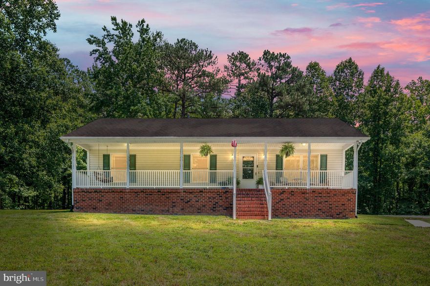 Welcome to your dream home, nestled in the tranquility of the countryside! This well-maintained rambler offers the perfect blend of comfort and functionality. Relax on the inviting, large front porch complete with a cozy porch swing - perfect for enjoying peaceful mornings and evenings. There is also a back patio, ideal for outdoor dining or entertaining. Large windows flood the kitchen and dining space with natural light, creating an inviting atmosphere and allowing the stainless steel appliances to shine.  Retreat to the generously sized primary bedroom, featuring a luxurious ensuite bath that offers a private sanctuary for relaxation. Two sizeable additional bedrooms, provide ample space for family, guests, or a home office. With plenty of storage options, including a convenient pull-down attic, you'll have all the space you need to keep your home organized. For hobbyists and DIY enthusiasts, the outdoor workshop is a fantastic bonus, offering a dedicated space for projects and storage. Experience the tranquility of country living while being within easy reach of modern conveniences. Conveniently located close to I-95, this home provides a peaceful retreat. 
Discover the charm and comfort of this country-living rambler. Schedule a showing today and make this serene and spacious property your new home!