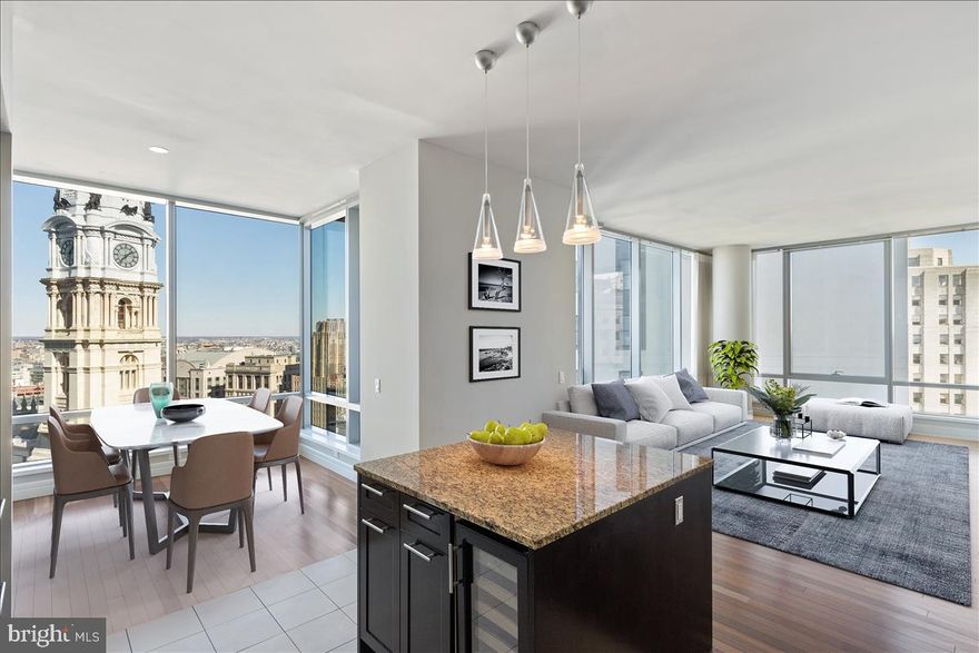 This beautiful residence on the 30th floor of The Ritz-Carlton Residences INCLUDES PARKING, its own balcony, windows that open and breathtaking views, day and night!
3 bedrooms, 2 and a half baths. The 3rd bedroom is perfect as an office or den, with double doors that open into the living room and the option to add a wet bar. Gorgeous Calacatta Gold marble in the primary bath and Crema Marfil marble in the guest bath.  New carpeting in the bedrooms and Brazilian Cherry floors in living areas. Two walk-in closets in the primary bedroom.  Dedicated residential staff delivering Legendary Ritz-Carlton service. 24-hour concierge, 24-hour valet parking in the secure on-site garage, exclusive chauffeur service in Mercedes sedan or Escalade, porters to bring and place your packages and dry cleaning in your foyer, pet friendly building with dog-walking arrangements.  Amenities include a 7000 s.f. state-of-the art fitness center with a great view, too.  Luxurious lounge with an almost wrap-around terrace overlooking Dilworth Park, media room, yoga room, indoor lap pool, hot tub, and a gated garden.  Call for room service from the adjacent Ritz-Carlton Hotel or stop by and enjoy a drink at the beautiful bar. Spa services available from Richel D Ambra on the 3rd floor of the hotel, and much more.