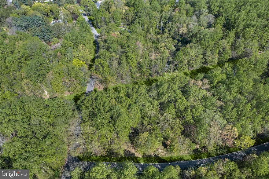 Excellent opportunity to build in the established The Woods community, known for its mature trees and sense of privacy. Ideally located in Owings Mills just off Greenspring Avenue, this 5.52-acre corner lot offers a serene, wooded setting complete with a natural stream. Approximately one acre presents potential for residential construction, while the remaining acreage enhances the property’s peaceful, natural surroundings. An excellent opportunity for buyers to explore development options, with buyers’ full due diligence required to determine land use, utilities, as well as septic and well feasibility. Property is subject to an existing easement in favor of the Transcontinental Gas Pipeline Corporation.