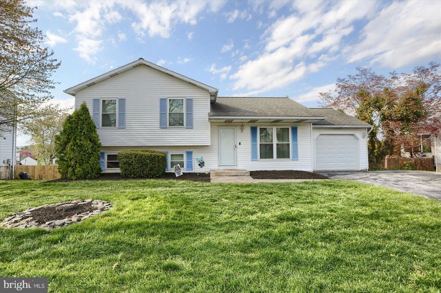 Updated four-tier split!  Beautiful floors greet you as you enter the living room.  Fully updated kitchen with tons of cabinets and countertop space, stainless steel appliances and room for the whole family!  Spacious bedrooms!  Full finished lower level with built in dry bar and full bath/laundry area!  Unfinished basement allows you plenty of space for storage!  Newer fenced in yard, perfect for the kids/animals!  Recent updates include new HVAC system, HW heater, additional insulation, windows and doors!  All this and still just minutes from major shopping and highway access!