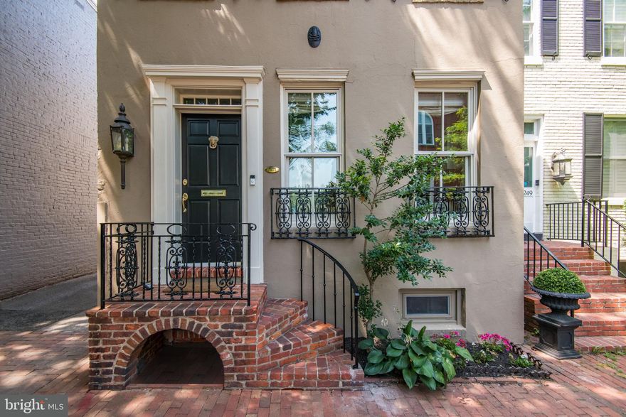 Reduced in price to $2,395,000!  Owner is ready to sell!  Welcome to 3253 P Street NW in the heart of Georgetown. A car lovers and Georgetown garden lovers dream come true. Two car garage parking plus another two parking spaces set this home apart!  A deep expansive garden offers lush views from the dining room and living room of the home. Top of the line finishes and mouldings with beautiful hardwood floors and high ceilings are hallmarks of the architectural details found throughout. This masterfully appointed residence offers a lovely wide floorplan and custom gourmet kitchen opening to a large dining room with fireplace and separate spacious living room with fireplace and built ins. The light filled kitchen has views through the dining room and living room to the garden. Living room doors welcome you out onto the large deep garden with expansive brick patio perfect for entertaining outdoors. The second level offers a luxurious owners suite with spacious marble bath and built ins, and an equally lovely second bedroom with private marble bath. The partially finished lower level provides two more rooms plus ample storage and a full size laundry. A special offering with extra special attention to detail and a total of four car parking!