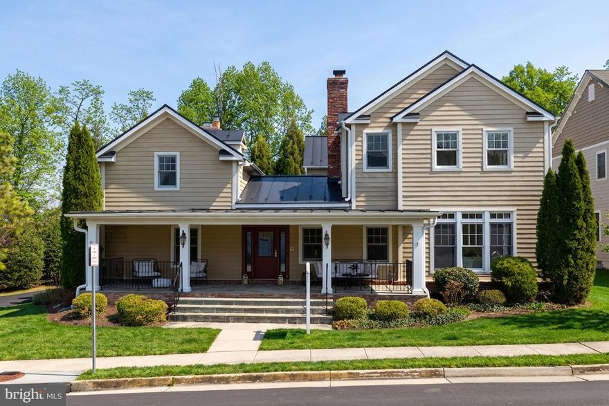 Welcome to the Powell-Ostrander House, a truly one-of-a-kind residence that beautifully blends the charm of the original 1800s farmhouse with the comfort and luxury of a thoughtfully designed custom home built in 2011. Offering 5,000 square feet, this remarkable property features five bedrooms, five full bathrooms, and one half bath creating a home that feels both historic and modern. Set at the end of a quiet cul-de-sac in a private community, the home sits on a serene quarter-acre lot surrounded by landscaped grounds and adjacent to a park-like setting with a pergola and green space. An expansive front porch welcomes you with generous room for seating and dining creating the perfect space to relax or entertain. Inside, the historic heart of the home is showcased in the stunning dining room with original wood beam ceilings, gleaming oak floors, custom cabinetry with bar, and a dramatic dual-sided gas fireplace. This central space connects the preserved farmhouse character with the thoughtfully expanded modern layout. The historic wing includes a traditional den with wood-burning fireplace and a charming living room or office with gas fireplace, both featuring original wood beams and wood-trimmed windows. Upstairs in the historic portion of the home, a loft-style bedroom with full bath offers a private and unique retreat. The gourmet kitchen is designed for both everyday living and entertaining, anchored by a large granite island and featuring a Viking refrigerator, 42-inch cooktop and double ovens. A spacious eat-in area opens through French doors to a private flagstone courtyard patio, creating seamless indoor-outdoor living. Just beyond the kitchen, the sun-filled family room offers oversized windows and a cozy fireplace shared with the dining room. A mudroom off the two-car garage leads to the main-level laundry room featuring a classic farmhouse sink. Upstairs, the primary suite offers a striking open joist ceiling, gas fireplace, walk-in closet, and a luxurious bath with claw-foot soaking tub, dual vanities, and glass shower with custom tile.  Two additional bedrooms each include their own en-suite bathrooms and windows for natural light. A home office with private balcony overlooks the courtyard below. The walkout lower level is ideal for entertaining with a large recreation room, wet bar, and wine refrigerator. A private fifth bedroom with full bath provides the perfect space for guests, an au pair, or multigenerational living. A second basement area connected to the historic portion of the home offers extensive storage. Additional modern safety feature of interior sprinklers throughout the home. Located in the City of Fairfax, residents enjoy municipal services including trash, recycling, and curbside leaf collection. The location is truly exceptional, within walking distance to Old Town Fairfax, the Fairfax Swimming Pool, Fairfax County Courthouse, and George Mason University. Just moments away is Daniels Run Park, a 48-acre wooded retreat with scenic trails, playgrounds, and picnic areas. Living here also means being part of the vibrant City of Fairfax community with beloved annual events such as the Chocolate Lovers Festival, Antique Car Show, Rock the Block, Beer in the Burbs, Movies Under the Moon, Fall Festival, Independence Day Celebration, and the Festival of Lights and Carols. This extraordinary home offers a rare opportunity to own a piece of Fairfax history while enjoying the space, comfort, and craftsmanship of modern construction.