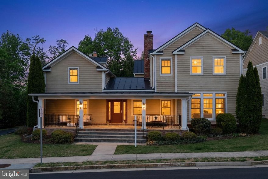 Welcome to the Powell-Ostrander House, a truly one-of-a-kind residence that beautifully blends the charm of the original 1800s farmhouse with the comfort and luxury of a thoughtfully designed custom home built in 2011. Offering 5,000 square feet, this remarkable property features five bedrooms, five full bathrooms, and one half bath creating a home that feels both historic and modern. Set at the end of a quiet cul-de-sac in a private community, the home sits on a serene quarter-acre lot surrounded by landscaped grounds and adjacent to a park-like setting with a pergola and green space. An expansive front porch welcomes you with generous room for seating and dining creating the perfect space to relax or entertain. Inside, the historic heart of the home is showcased in the stunning dining room with original wood beam ceilings, gleaming oak floors, custom cabinetry with bar, and a dramatic dual-sided gas fireplace. This central space connects the preserved farmhouse character with the thoughtfully expanded modern layout. The historic wing includes a traditional den with wood-burning fireplace and a charming living room or office with gas fireplace, both featuring original wood beams and wood-trimmed windows. Upstairs in the historic portion of the home, a loft-style bedroom with full bath offers a private and unique retreat. The gourmet kitchen is designed for both everyday living and entertaining, anchored by a large granite island and featuring a Viking refrigerator, 42-inch cooktop and double ovens. A spacious eat-in area opens through French doors to a private flagstone courtyard patio, creating seamless indoor-outdoor living. Just beyond the kitchen, the sun-filled family room offers oversized windows and a cozy fireplace shared with the dining room. A mudroom off the two-car garage leads to the main-level laundry room featuring a classic farmhouse sink. Upstairs, the primary suite offers a striking open joist ceiling, gas fireplace, walk-in closet, and a luxurious bath with claw-foot soaking tub, dual vanities, and glass shower with custom tile.  Two additional bedrooms each include their own en-suite bathrooms and windows for natural light. A home office with private balcony overlooks the courtyard below. The walkout lower level is ideal for entertaining with a large recreation room, wet bar, and wine refrigerator. A private fifth bedroom with full bath provides the perfect space for guests, an au pair, or multigenerational living. A second basement area connected to the historic portion of the home offers extensive storage. Additional modern safety feature of interior sprinklers throughout the home. Located in the City of Fairfax, residents enjoy municipal services including trash, recycling, and curbside leaf collection. The location is truly exceptional, within walking distance to Old Town Fairfax, the Fairfax Swimming Pool, Fairfax County Courthouse, and George Mason University. Just moments away is Daniels Run Park, a 48-acre wooded retreat with scenic trails, playgrounds, and picnic areas. Living here also means being part of the vibrant City of Fairfax community with beloved annual events such as the Chocolate Lovers Festival, Antique Car Show, Rock the Block, Beer in the Burbs, Movies Under the Moon, Fall Festival, Independence Day Celebration, and the Festival of Lights and Carols. This extraordinary home offers a rare opportunity to own a piece of Fairfax history while enjoying the space, comfort, and craftsmanship of modern construction.