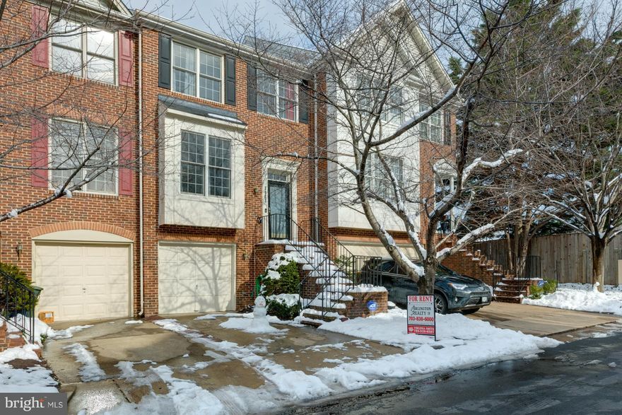 APPLY ONLINE:  https://arlingtonrealty.appfolio.com/listings/detail/97e266b8-5d96-4753-90b8-01899b88ed27.  Stately Upgraded Townhouse in prime close in location.   Just 2 miles to Crystal City Metro.  2 stoplights to Washington DC.  1 mile to Potomac Yard & Amazon's new Headquarters.  Nearly 2,000 sq. ft. of living on 3 levels. Bright & airy with modern open floor plan and 9' ceilings.  Eat in updated kitchen with granite countertops and all new stainless steel appliances - overlooks sitting / dining area with gas fireplace.  All bedrooms on the upper level. Master suite with vaulted ceilings & luxury master bath with oversized tub & separate shower. Fully finished lower level with rec. room, and newly upgraded full bath.  Spacious rear stone patio - fully fenced. 1 car attached garage. New washer & dryer.  Off street driveway. Furniture is now removed.
