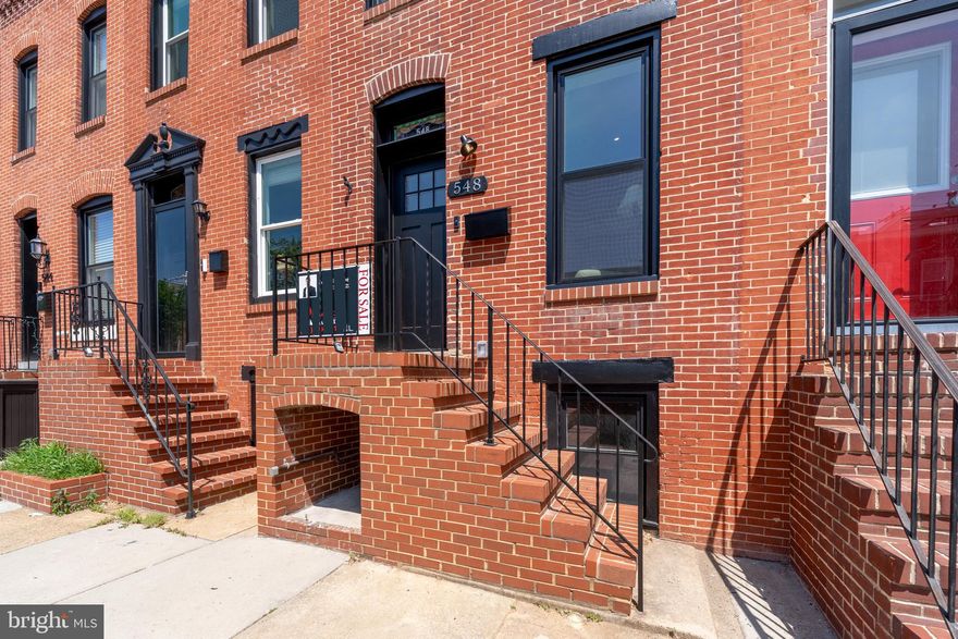 Welcome to 548 E Fort Ave!  Located in central Riverside, South Baltimore, you have only a few blocks walk to everything!  Shopping/gym, cafés, restaurants, the water…whatever it is, it’s close to YOUR new address.  And that address comes with a feature list that rivals homes costing TWICE as much:  Outside, find nearly 400 SF of outdoor composite decking, partially covered with a pergola on the rooftop; fully fenced yard AND PARKING for 2 compact vehicles.  

Inside, prepare to be visually and practically stunned:  Custom metal interior railings, reclaimed/restored stained glass atop the front entry, a wood burning fireplace in your living room, solid white oak hardwoods throughout, Solid interior doors, a Chef’s kitchen w/high end appliances, built in microwave and cold beverage storage, J&K Cabinetry, under-cabinet lighting, custom tile backsplash.  A ½ bath is included on the main level for the ultimate convenience with space for entertaining in both the dining area and at the massive kitchen island too!  

On the upper level, the primary suite includes a custom bathroom complete with Delta fixtures, custom shower door, and quartz counters.  The primary closet has copious space (almost 9’ long) and with double French doors to your deck(s), morning coffee has an unparalleled view for you now.  The 2nd bedroom is at the front of the home with 9’ ceilings, recessed lighting and ceiling fan and it’s own hall bathroom with tub/shower combo mirrors the primary bath’s finishes with its own twist.  

In the basement, there’s a 3rd bedroom and a custom dry bar for your convenience.  Stacked High Efficiency Laundry is at the bottom of the basement stairs as well as the mechanicals and your power vent gas water heater.  

Buy CONFIDENTLY knowing this home has been completely rehabbed with ALL PERMITS by a well-known local builder and has features no one talks about because they don’t have them:  BRAND NEW Sewer line to the edge of the lot; BRAND NEW Parking Pad; BRAND NEW mechanicals, electrical (and service) and plumbing; BRAND NEW Roof with a FULL TEAR OFF; BRAND NEW Windows, BRAND NEW basement concrete and drain tile, spray foam insulated and encapsulated crawl space, and much, MUCH MORE!