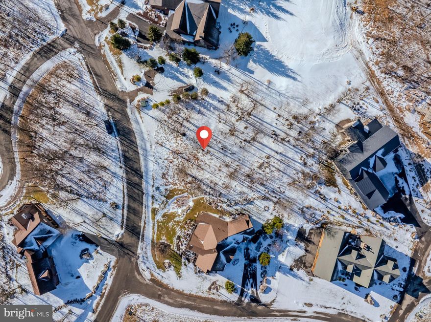 Discover an exceptional opportunity at 57 North Camp Road in McHenry, MD — a premier ski-in/ski-out homesite perched on the slopes of Wisp Mountain. Perfectly positioned off both Ace’s Run and Ridge Run (Chair 7), this property offers true mountain convenience with instant access to winter adventure right from your doorstep. Set high on the mountain, this lot features breathtaking panoramic views and unforgettable sunsets stretching across the valley and surrounding peaks. Whether you’re gearing up for a day on the slopes or relaxing with a cup of hot tea as the sun dips behind the mountains, this location delivers year-round beauty and serenity. Located just minutes from Deep Creek Lake, the ASCI Whitewater Rafting Course, and the expansive 550-acre Fork Run Recreation Area, the possibilities for outdoor recreation are endless. Enjoy skiing, snowboarding, whitewater rafting, hiking, mountain biking, kayaking, golfing, and countless other activities — all within easy reach. This is the perfect lot to build your dream mountain home, weekend retreat, or a vacation rental. With four-season adventure at your fingertips and one of Deep Creek’s most desirable ski communities as your backdrop, 57 North Camp Road is a rare opportunity to own a true lifestyle property.