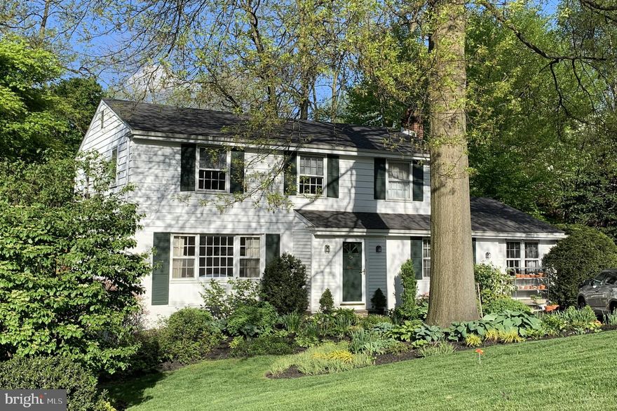 This classic colonial style single is unique because it has a first floor Bedroom and full Bath, compared to other houses in the neighborhood.  Located in the heart of Wyndmoor the five bedroom, three bath house has room for everyone!  A white clapboard exterior and brand new asphalt shingle roof and deck complement the incredible garden and specimen planting that this owner has beautifully maintained during ownership.     A small entryway, with coat closet and storage area for hanging items,  leads to a front hall.  The Living Room is on the left with built-in bookshelves and a large picture window.  This opens to the Dining Room with glass patio doors to a large treated wooden deck with railing and steps to the back yard.  The cheerful Kitchen next to the Dining Room is eat-in and includes double ovens, one of which is convection/microwave and a vent hood above the gas cooktop.  The Back hall includes pantry storage closet, a small Office, a Den with beamed ceiling, brick fireplace and closet.  A first floor Bedroom with two closets and a Hall Bath with tub/shower completes the first floor layout.  The Second Floor has four additional Bedrooms.  The master has a dressing area, a walk-in closet, linen closet and an adjoining Bath with stall shower.  The Hall has a linen closet and pull down for attic storage.  There are three additional Bedrooms, all with large closets and a Hall Bath with a tub/shower.  The Basement has a large Family Room with a tile floor and sliding doors to the outside under the deck.  There is a large storage shed as well.  A utility room with laundry hook ups complete the basement floor plan.  The heat is baseboard hot water and there are hardwood floors throughout with the exception of the Kitchen and First floor Bedroom.   This is an ideal location with ability to walk to the heart of Wyndmoor and the shops of Chestnut Hill.  A huge plus is the newly constructed Elementary School of Springfield Township Public Schools and access to trains to Center City and Pa. Turnpike for easy travel. Documents available, include Sellers Disclosure, Building Inspection, Termite, Radon, Updates after Inspection, and Maintenance Dates for Improvements. Showings start Monday, June 1, 2020.