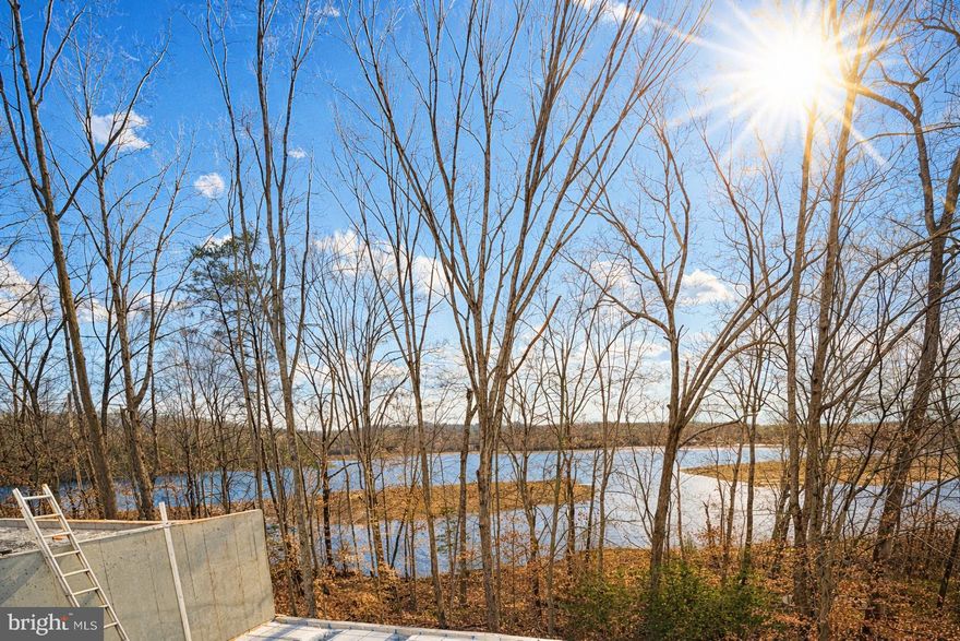 YOUR DREAM HOME IS UNDER CONSTRUCTION - AQUIA HARBOUR – WATERFRONT – AQUIA CREEK/CHANNEL – AVAILABLE LATE APRIL – Welcome  home! This stunning 5-bedroom Haven by award-winning builder Foundation Homes offers the perfect blend of classic colonial charm and modern craftsman design. This soon-to-be-completed waterfront home is designed to capture breathtaking views of the Aquia  Creek/Channel, providing direct access to the Potomac River. Enjoy your morning coffee on the screened-in back porch or soak up the sunshine on the rear deck—you’ll rush home just to take in the views year-round. Step inside from the inviting front porch into a spacious foyer, flanked by a private flex room with double doors and a formal dining room that flows seamlessly into the gourmet kitchen. Designed for both everyday living and entertaining, the kitchen features white shaker-style soft-close cabinetry, quartz countertops, a large stainless steel farm sink, stainless steel appliances, and an expansive island ideal for gathering. Oversized windows flood the open-concept kitchen, dining area, and family room with natural light, creating a warm and welcoming atmosphere. The main level offers 9-foot smooth ceilings and durable luxury vinyl tile flooring, perfect for busy households. A beautiful oak, curved staircase leads to the upper level, where you’ll find four bedrooms and a convenient laundry room. The owner’s suite is a true retreat with two walk-in closets, a linen closet, and a spa-like en suite bath featuring double vanities, a soaking tub, and a tile shower.  The additional bedrooms are generously sized with ample closet space. The finished basement includes a spacious recreation room, media room,  the fifth bedroom, and a full bath. Aquia Harbour is a sought-after community filled with amenities for everyone and is conveniently located near shopping, dining, I-95, Route 1, Quantico, and the Brooke VRE Station is approximately 4 miles away—ideal for commuters. Enjoy serene water views while staying close to everyday conveniences. With a prime location, beautiful design, and modern functionality, this Haven truly checks all the boxes. Make it yours today. Photos are similar to the home under construction and not exact; please see Documents for specific selections. Contact the listing agent to tour a more completed Haven.