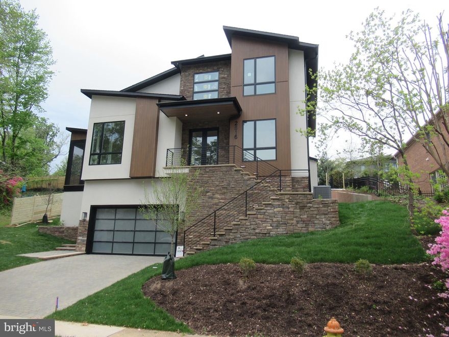 Stunning Contemporary by Troutman Homes.  Pictures and floor plans coming.  Mid-May completion date.  6 bedrooms, 6.5 baths.  2-car garage.  Bonus storage area adjacent to garage - perfect to store bicycles, sports equipment, etc... Main level has traditional Living Room, Separate Dining Room, Family Room off kitchen w/ gas fireplace.  Den/Office.  Luxury Kitchen with dual refrigerators, 6-burner Jenn Aire stove plus combination wall oven/microwave.  Island with exceptional storage space.  Breakfast Bar.   Butler's Pantry Room features additional counter area, 2nd sink, walk-in- pantry, wine cooler, additional refrigerator.  4 Spacious Bedrooms on top floor.  Luxury Bath in Primary Bedroom w/ soaking tub, over-sized separate shower stall.  All other Bedrooms feature full baths.  Laundry room has built-in ironing board, pull-down stairs to attic.  Lower-level features Large Rec Room w/ gas fireplace.  Two additional Bedrooms and two full baths.  One Bedroom also set up as optional Media Room.  Mud Room off garage entrance and 2nd Mud Room off informal additional entrance from ground level.