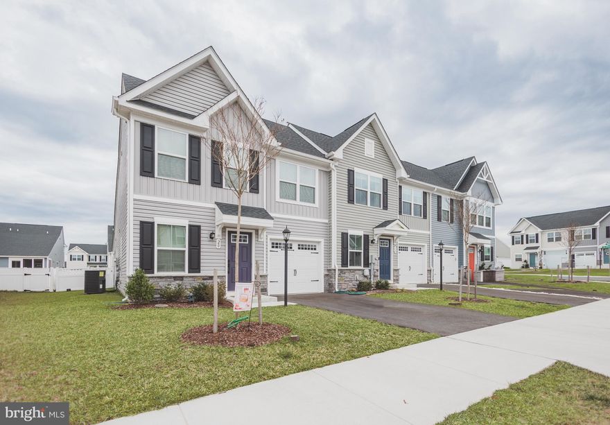 Price improvement.   Now $285,000.00.  Welcome to 20 Bibury St, Martinsburg, WV 25405
This nearly new townhome, built in 2023, offers modern living with numerous upgrades. Spanning 1,586 square feet, the home features 3 bedrooms and 2.5 bathrooms. The open-concept main level showcases luxury vinyl plank flooring throughout the living areas, complemented by an upgraded color palette. The kitchen boasts a spacious center island, granite countertops, stainless steel appliances, and backsplash, seamlessly flowing into the living and dining spaces.  This home also features the primary bedroom and bathroom on the main level.   Step outside to a covered patio, complete with a ceiling fan, perfect for outdoor relaxation. The backyard is enclosed with a beautiful vinyl fence, providing both privacy and aesthetic appeal.