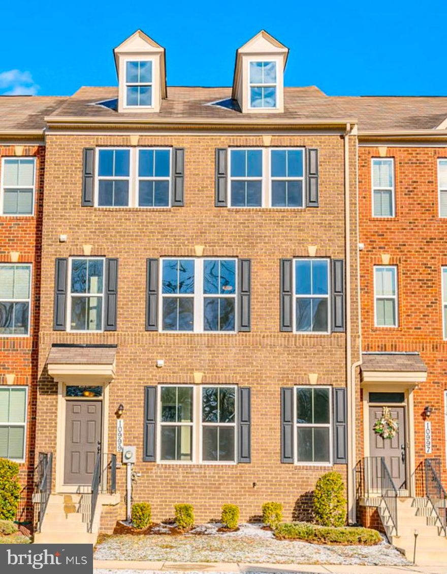 Welcome to Exquisite Living in Westchester Square. This exceptional 3-level brick-front townhome offers the perfect blend of modern luxury and comfortable living. The four bedrooms, three full bath and a half, oversized two-car garage, and large deck creates this stunning residence and is a must-see! Entertain in style when you access your dream home through either the convenient rear garage entry or the welcoming front door. The main level boasts versatility with a guest bedroom and ensuite full bath, ideal for all uses as a family room, home office, play area, gaming room, or exercise space. Ascend to the upper level and discover a fantastic open floor plan featuring recessed lighting, a spacious eat-in kitchen, living room, dining area, convenient half bath. The off kitchen access to the large deck for star gazing and relaxing. The gourmet kitchen delights and is the heart of this home with an impressive design with the discerning chef in mind. The kitchen showcases high-end finishes, stainless steel appliances, and elegant Quartz countertops. The expansive island has a large basin sink, pendant lighting, with ample seating with dedicated space for food preparation. This space includes extensive cabinetry, generous counter space, a spacious pantry, and a dedicated closet for cleaning supplies and larger appliances. Relax and Rejuvenate as you retreat to the upper level to find the luxurious primary suite, complete with an ensuite bathroom featuring a spacious two-person shower, a double-sink vanity, and a large walk-in closet. Two generously sized bedrooms share a full hall bathroom and convenient laundry room equipped with an upgraded front-load washer and dryer. Community Perks advantages include a community outdoor pool, refreshing jog on the paved loop, dog park, and beautifully landscaped grounds. Experience the epitome of refined living in Westchester Square. Easy access to I-495/95 and Rt.3/301. Close to grocery, shopping, dining & entertainment. You’ll love the proximity to schools, shopping, and major highways. A short drive to National Harbor, Washington, DC, and Metro stations. Welcome Home!