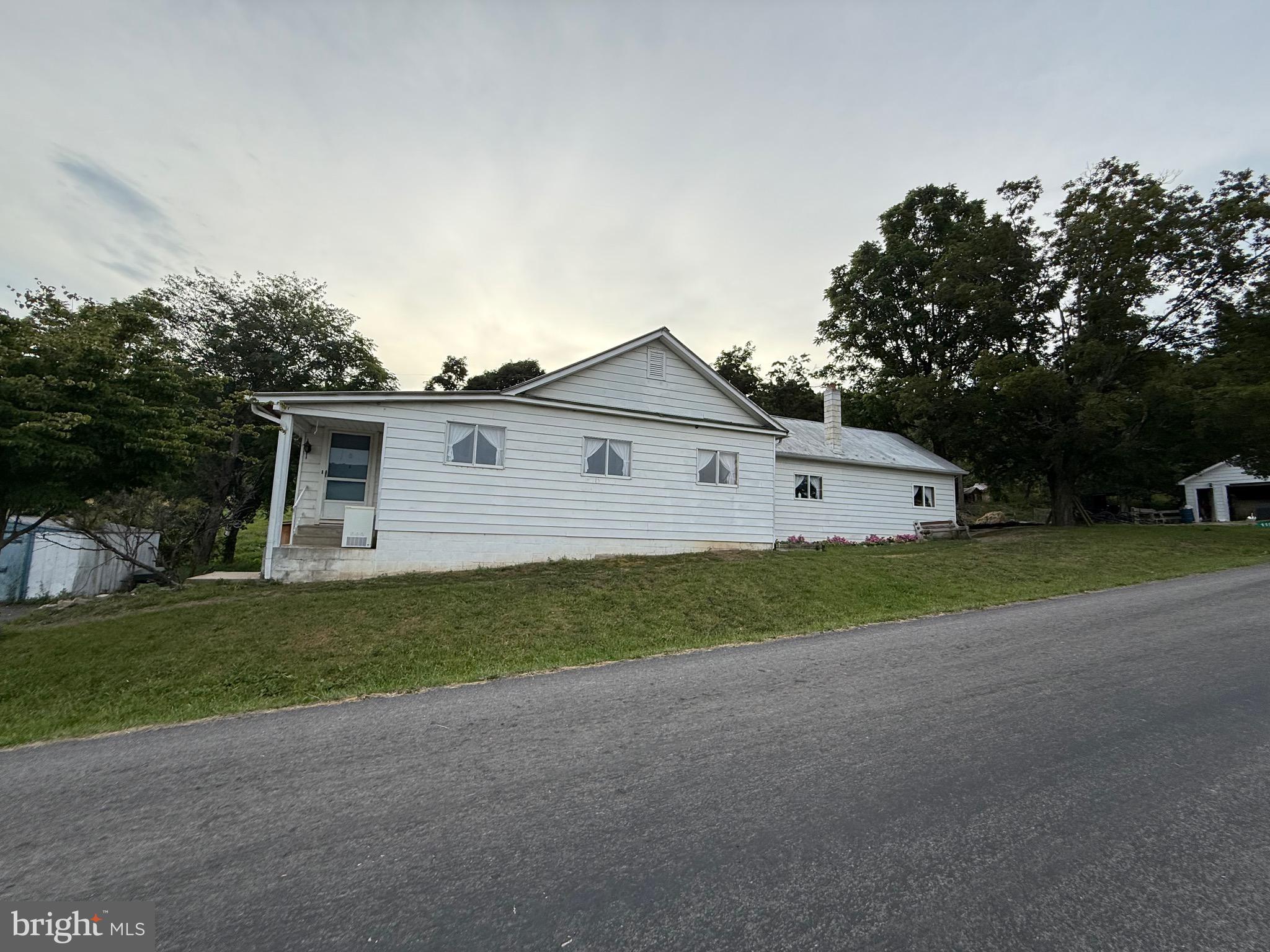 4 bedroom 1 bath home with country living with this small farmette. Bring your horse, cow, or goat. Would make a great rental or your own residential home. Small stream runs thru property. Garage, barn, and couple other sheds.