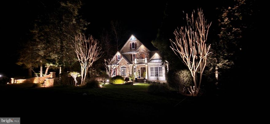 Experience the beauty and craftsmanship of this extraordinary custom-designed Mediterranean-inspired home offering over 5,340 finished square feet on three beautifully finished levels. Rich in architectural detail and thoughtfully designed for both elegant entertaining and comfortable everyday living, this 5-bedroom, 4.5-bath residence is truly one of a kind.
A dramatic foyer welcomes you with Italian marble flooring and soaring 13-foot ceilings, setting the tone for the exceptional quality found throughout the home. Extensive custom woodwork, arched entrances, and timeless finishes create warmth and character at every turn. The living room features cathedral ceilings and oversized windows that fill the home with natural light, while the stunning great room offers custom built-ins, a stone gas fireplace, and an entire wall of windows overlooking the private, park-like backyard.
The kitchen is a work of art inspired by Spain, featuring handcrafted Brazilian accent tiles, Saltillo paver flooring from Northern Mexico, and distinctive finishes that make the space both functional and unforgettable.
Retreat to the spacious primary suite with tray ceiling and a lavish marble ensuite bath complete with dual vanities, oversized soaking tub, and a large walk-in shower. The upper level also includes three additional bedrooms and two full bathrooms.
The bright walk-out lower level provides exceptional flexibility with a spacious recreation room, fifth bedroom, full bath, and abundant storage areas.
Outside, the grounds feel like a private resort. Enjoy beautifully landscaped perennial gardens, extensive down and uplighting, peaceful water fountains, a koi pond, and two charming swings tucked beneath the deck. Seasonal Magothy River views and views of the pond create a truly tranquil setting.
Located in an exclusive waterfront community offering a pier with boat slips, beach, waterside picnic areas with stone pavers and grills, playground, tennis courts, basketball court, and sports court, this exceptional property combines luxury living with an unmatched lifestyle. All just minutes from downtown Annapolis and within the highly sought-after Broadneck Blue Ribbon school district.