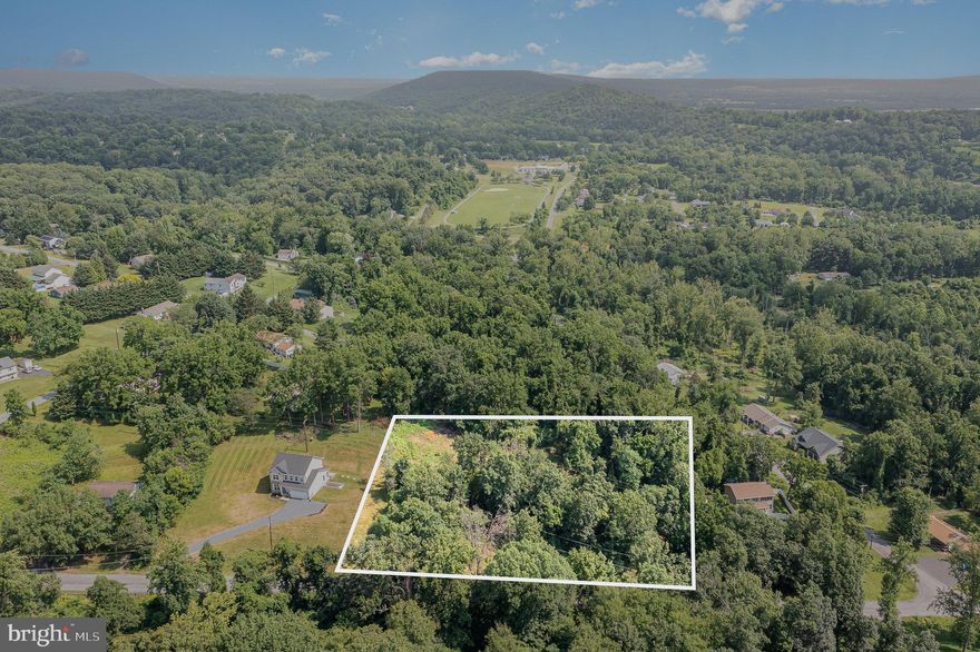 Move to the country and build the life you’ve been dreaming of. 

Tucked into the trees on 1.61 wooded acres in scenic Carroll Valley, this property feels like your own quiet retreat. It’s already perc-approved with septic plans for a 4-bedroom home, featuring an installed driveway and a cleared homesite, a head start toward something truly your own. With no builder restrictions and prefab or tiny homes welcome, you have the freedom to create what feels right, not what’s expected.


Here in the peaceful foothills of Adams County, every day starts with mountain air and ends in stillness. Yet, convenience is never far, Ranch Trail Commons, Liberty Mountain Resort, and Route 16 are just minutes away, with easy drives to Gettysburg, Waynesboro, Hagerstown, and Frederick.


Fairfield and Carroll Valley are places where life moves at an easier pace—where kids still ride bikes on quiet roads, neighbors wave, and the views remind you to slow down. With rolling hills, top-rated schools, and a community built on space and simplicity, this is more than a homesite. It’s where the next chapter of your story begins.