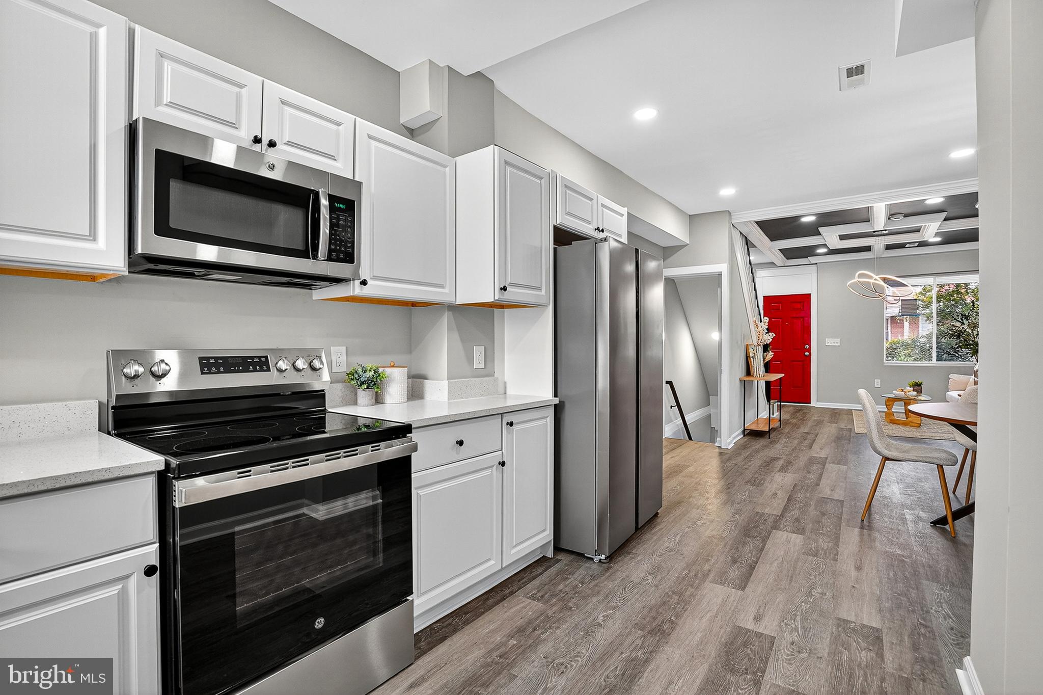 Welcome to your new home at 2539 Aisquith St, Baltimore, MD 21218! This beautifully renovated 3-bedroom, 3-full-bathroom townhome offers a perfect blend of modern amenities and classic Baltimore charm.
As you approach the home, you'll be greeted by a traditional brick facade and a striking red front door, setting a welcoming tone. Step inside to discover a bright and open floor plan with stylish gray LVP flooring and a dramatic dark blue and white coffered ceiling that adds a touch of sophistication. The living room is a comfortable space for relaxation.
The dining area, conveniently located between the living room and kitchen, is perfect for family meals or entertaining guests. The kitchen is equipped with sleek black and white appliances, including a large refrigerator and ample white cabinetry, providing both functionality and style. A striking red door leads to a private outdoor space.
Upstairs, you'll find the cozy bedrooms, each featuring plush gray carpeting and neutral-toned walls, creating a serene and peaceful atmosphere. The bathrooms are a highlight, with modern fixtures, beautiful tile work, and a classic black and white color scheme.
The lower level offers additional flexible space that can be used as a family room, home office, or guest area, and includes an additional full bathroom, making this home incredibly versatile.
The backyard is a private, fenced-in space, perfect for outdoor gatherings, gardening, or a secure play area for pets. The location is ideal, with close proximity to Clifton Park and easy access to Route 83 for convenient commuting.
This home is a must-see for anyone looking for a stylish, comfortable, and conveniently located property in Baltimore. Don't miss your chance to make it yours!
