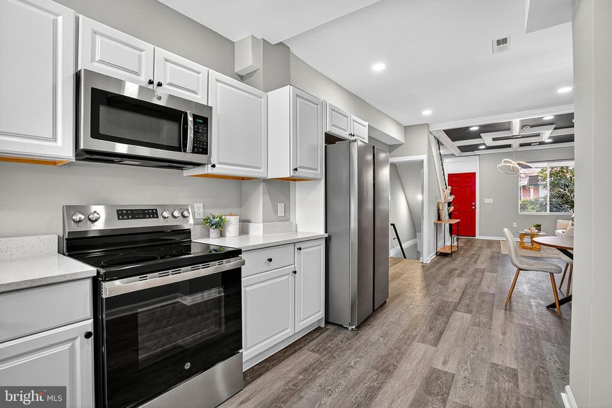 Welcome to your new home at 2539 Aisquith St, Baltimore, MD 21218! This beautifully renovated 3-bedroom, 3-full-bathroom townhome offers a perfect blend of modern amenities and classic Baltimore charm.
As you approach the home, you'll be greeted by a traditional brick facade and a striking red front door, setting a welcoming tone. Step inside to discover a bright and open floor plan with stylish gray LVP flooring and a dramatic dark blue and white coffered ceiling that adds a touch of sophistication. The living room is a comfortable space for relaxation.
The dining area, conveniently located between the living room and kitchen, is perfect for family meals or entertaining guests. The kitchen is equipped with sleek black and white appliances, including a large refrigerator and ample white cabinetry, providing both functionality and style. A striking red door leads to a private outdoor space.
Upstairs, you'll find the cozy bedrooms, each featuring plush gray carpeting and neutral-toned walls, creating a serene and peaceful atmosphere. The bathrooms are a highlight, with modern fixtures, beautiful tile work, and a classic black and white color scheme.
The lower level offers additional flexible space that can be used as a family room, home office, or guest area, and includes an additional full bathroom, making this home incredibly versatile.
The backyard is a private, fenced-in space, perfect for outdoor gatherings, gardening, or a secure play area for pets. The location is ideal, with close proximity to Clifton Park and easy access to Route 83 for convenient commuting.
This home is a must-see for anyone looking for a stylish, comfortable, and conveniently located property in Baltimore. Don't miss your chance to make it yours!
