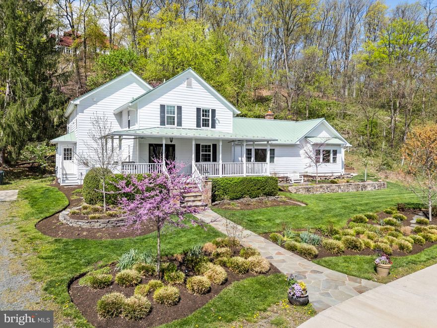 **Back Up Offers Being Accepted!***Welcome to one of Loudoun County’s most exceptional properties—an artfully renovated 1850s farmhouse that blends historic charm with top-tier modern updates, all set on nearly 5 acres just outside downtown Leesburg. With direct views of the 1,000-acre Morven Park—which is protected from development forever—you’ll enjoy peace, privacy, and stunning vistas that are truly yours to keep. Best of all, you’re just a short walk from Ida Lee Park, downtown restaurants, and all the best of Leesburg living—without paying town taxes or dealing with historic district restrictions.

The main house has been meticulously updated, including a brand new metal roof and HVAC system. The kitchen has been beautifully redone with premium appliances and finishes, flowing into a bright breakfast room that invites morning sunshine. A luxurious main-level primary suite—added in 2017—features vaulted ceilings, heated bathroom floors, and thoughtfully designed walk-in closets. Upstairs, three additional bedrooms each have their own full bath, plus a bonus room for added flexibility. The lush landscaping features native plantings and a fully fenced garden with raised beds and irrigation—perfect for anyone with a green thumb.

The converted barn-turned-Barndominium is where history meets wow-factor. Soaring ceilings, exposed beams, a high-efficiency wood-burning stove, and original stonework create a warm, dramatic space. The open living area connects seamlessly to an expansive patio, while upstairs a loft suite offers a private bedroom or office with a full bath, walk-in closet, and access to a massive wraparound rooftop deck with 360° views. The three-car garage includes an EV charger, and there's a second charger at the main house. With every detail thoughtfully curated and views that are yours forever, this property is a once-in-a-lifetime opportunity.