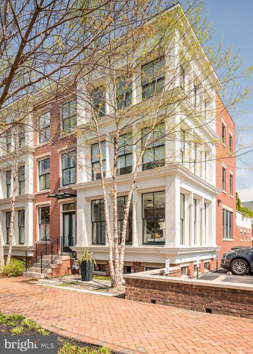 317 North Columbus Street is a rare opportunity in Old Town Alexandria. Built in 2014, with exterior style inspired by the cast iron architecture of SOHO in the 1850s, this end unit, four-level townhome is LEED Gold certified.  Incredibly upgraded and maintained, it features 4 bedrooms, 4.5 baths, floor-to-ceiling windows with views of Old Town landmarks, a highly efficient geothermal HVAC system, Wolf/Thermador kitchen appliances, custom living room/kitchen/bath/wet bar cabinetry, two-car garage, and a private patio.  An absolute must-see, one-of-a-kind property.  Please consult listing broker and see list for details of the custom finishes and improvements.