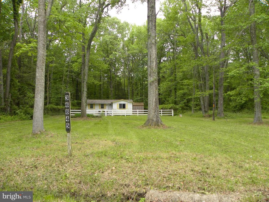 Cozy cottage style Ranch home located on a quaint woodsy private lot located in Longview Subdivision which offers water access to the Wicomico River where you can boat. crab, fish and hunt.  Convenient commuter location to D.C., Andrews, or PAX.  ***This is a foreclosure property therefore selling "as Is" condition. *** House needs work but you could fix it up really cute for your primary residence or a summer vacation home.  Well information attached, Health Dept. requires a sewage holding tank for this property, to be installed and paid for by purchaser.  Estimated price $20,000 but check with the county regarding a possible grant.  Documentation is uploaded in the MLS from the Health Dept.  And per Documentation one has to use the original foot print and cannot add on to the house. Priced well to sell fast!***Cash offers only,  a conventional type loan to be determined if considered and cannot be based on property condition.***