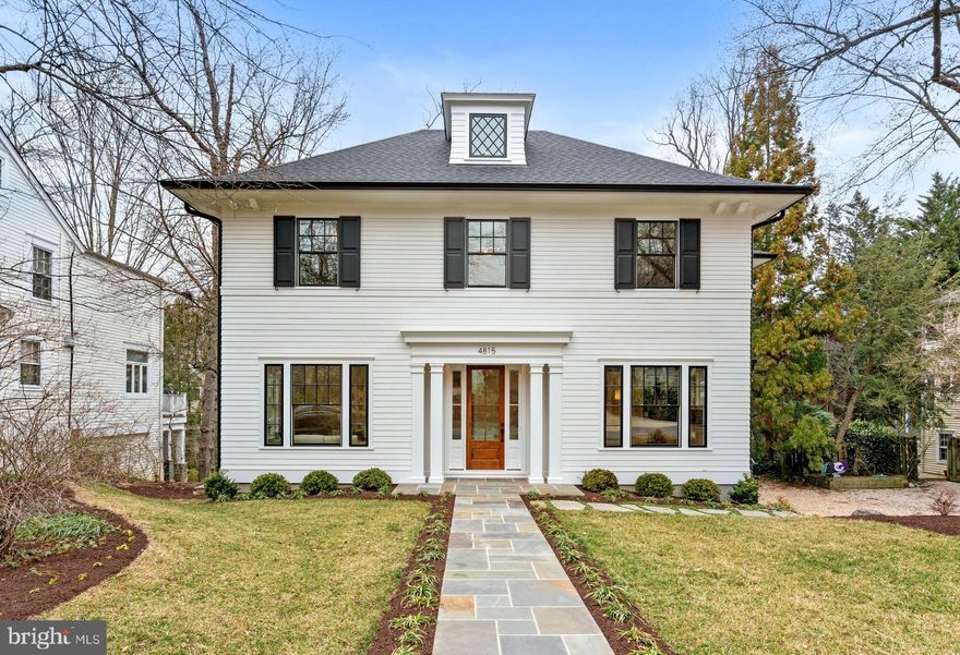 This newly constructed residence in the coveted Somerset neighborhood presents a unique opportunity, masterfully crafted by Kelly Development and designed by the award-winning GTM Architects. This four-level home seamlessly blends classic craftsmanship with modern luxury, ensuring that no detail was overlooked in its high-quality construction. The facade is traditional in style, complete with handcrafted trim and a stone walkway leading to the welcoming entrance. An elevator inside provides convenient access throughout the house.
The home's refined interior offers attractive hardwood floors and crown moldings, creating an ambiance of sophistication and timeless beauty. The expansive open concept floor plan seamlessly integrates high ceilings and oversized windows, enhancing the natural light that floods the thoughtfully designed living spaces. These generously scaled rooms are well suited for entertaining and everyday living, providing an ideal balance of style and comfort.
The main level features a gracious formal living room and dining room which create an inviting atmosphere for gatherings. The nearby gourmet kitchen is well-appointed, featuring extensive cabinetry, a large center island with breakfast bar, and top-of-the-line appliances from Bosch, Wolf, and Subzero. Adjacent to the kitchen is a sizable breakfast room, butler's pantry and wet bar, along with a spacious family room that includes an electric fireplace and French doors opening to the screened porch, which beautifully extends the living space. There is also a convenient mudroom on the first level, with a side entrance that provides easy access to the detached two-car garage.
The second floor presents a luxurious primary suite, featuring two expansive walk-in closets, and a spa-inspired marble bathroom with dual vanities, a frameless glass shower with multiple shower features, and a free-standing soaking tub. Three more generously sized bedrooms on this level offer ample closet space and privacy, while a second-floor laundry room adds functionality. The third floor has an additional bedroom, full bathroom, and loft area, suitable for use as a home office or top floor sitting room. The lower level has a spacious recreation room with a custom-built bar, extensive storage, and double doors leading to a large rear patio for seamless indoor-outdoor entertaining. This level also includes a guest room, a full bathroom, and an exercise room.
The exterior of the home showcases a hardscape terrace with an appealing dining area, while the backyard offers mature trees and greenery. This beautiful offering provides immediate access to Norwood Park, Capital Crescent Trail, downtown Bethesda, Friendship Heights, and nearby metro stations. It also has access to the Somerset community pool, parks, tennis, and basketball courts. This residence is a rare find, perfectly located on one of the most desirable streets in Somerset.