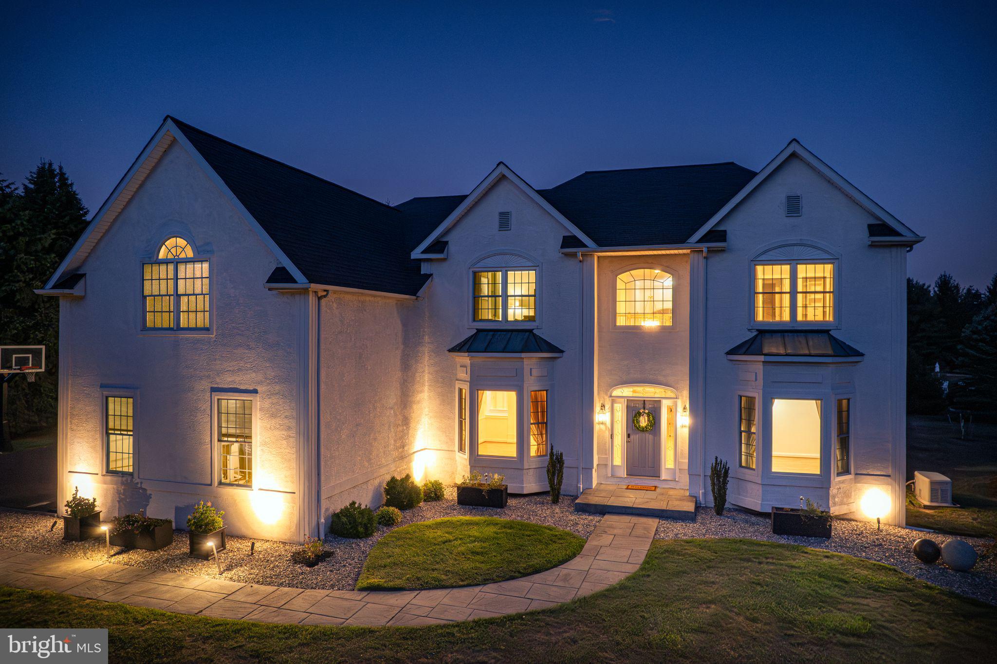 Welcome to 2 Old Barn Court, a gorgeous 5,202 sq.ft. colonial nestled on 1.58 acres of beautiful rolling property in the prestigious, welcoming Upper Makefield community of Valley View Estates and highly desirable Council Rock School District. Built by David Schrenk in 1997, this home blends great curb appeal and big, bright open spaces with easy everyday comfort. This home is just so easy to love. A gracious 2-story foyer opens to formal living and dining rooms and introduces 10 foot ceilings that continue throughout the first floor. A two-story Great Room featuring custom built-in bookcases, a sun-drenched Palladian window and dual-sided gas fireplace beckons you to sit down and relax. Enjoy gathering with friends and family? This Norwyck floor plan provides seamless indoor/outdoor entertaining with access to a stunning patio through glass sliders in both the Great Room and kitchen. Summer doesn't get any better than outdoor grilling, keeping cool in the in-ground pool, savoring drinks at a built-in bar and finishing the day snuggling on bench seating around a cozy gas fire pit. This is the backyard retreat everyone wishes they had. If cooking is your favorite pastime, you will love the bright, airy kitchen with bright white painted cabinets, an eye-catching tile backsplash, large center island with breakfast bar, expansive counter space, beautiful views from every window and stainless appliances with a glass cooktop. Best yet, turn on the cozy fireplace while you prepare a meal. Work from home? Take advantage of the private office with built-in desk. A laundry/mudroom and powder room complete the first floor. Follow the turned staircase with large picture window to the 2nd level where you will find 4 bedrooms with large closets and 3 full baths. The primary bedroom offers so many facets - tray ceiling, spacious sitting room/office/exercise room, dual walk-in closets with custom organizer systems, an additional room with unlimited possibilities, and a luxury ensuite bath with jacuzzi tub, glass-enclosed shower and expanded white vanity. The next bedroom also has a walk-in closet and ensuite bath with stall shower. Two additional bedrooms share a newly remodeled Jack and Jill bathroom. Looking for extra storage or recreational space? The full walk-up basement begins with a 10' ceiling, a small finished entranceway and provides 2,174 sq.ft. of pure unfinished potential for your future finishes. It is even pre-plumbed for a bathroom. Updates/upgrades include Marvin replacement windows throughout 1st floor + 3 bedrooms, low voltage landscape lighting, newer vinyl pool liner and pump (2024), newly refinished hardwood flooring (8/2025), newly remodeled Jack and Jill bath with radiant heat (8/2025), new roof and gutter guards (2021), two water heaters (< 6 years), reverse osmosis water filter and water softener (2025), and heat pump HVAC with propane back-up for coldest weather. Appreciate easy commuting to NYC via local trains w/in 15 minutes, Philly via local trains and I-295, Princeton/Hopewell via I-295, and King of Prussia via PA Turnpike. Don't miss all the fabulous shopping and local eateries in nearby Newtown and Yardley. Enjoy being outdoors? Spend your downtime walking/riding on the nearby 58 mile Delaware Canal towpath or hiking in four state & county parks. Make 2 Old Barn Court your own and begin living the quintessential Bucks County life and all it has to offer.