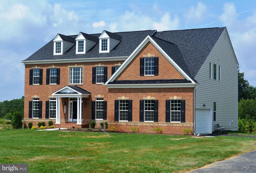 Welcome to the Monticello! This new construction offers 4 bedrooms, 4.5 baths, and contains a side-load 2-car garage.

On the main level, you'll find a two-story foyer leading to a formal dining room and living room at the front of the home. The 10ft ceilings throughout this level create an enhanced sense of spaciousness. As you move further in, you'll find the family room, complete with a coffered ceiling and gas fireplace, which seamlessly flows into the kitchen with a morning room addition. The gourmet kitchen features stainless steel appliances and expansive kitchen island.

The second level offers 9ft ceilings, 4 additional bedrooms, and 3 bathrooms. The primary bedroom features a sitting room, exercise room, spacious walk-in closets, and an upgraded super bath. The finished lower level includes 9 ft. ceilings, a recreation room, and an additional full bath. 

Photos of similar home are for representation only and may show options or upgrades not included in this home.