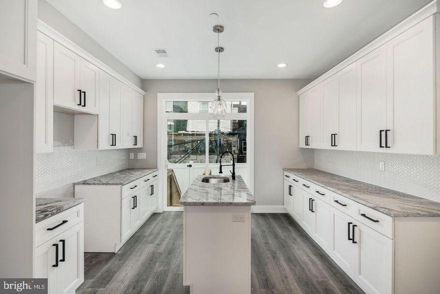 New construction 4 bedroom, 3.5 bathroom home with luxury finishes and large rooftop deck. Light-filled bedrooms and modern bathrooms. Hardwood floors and tile throughout. Gorgeous kitchen with granite countertops, stainless steel appliances, tons of storage with access to a private, fenced rear yard! 3rd floor master suite has custom tray ceiling with crown molding illuminated with accent lighting, walk in closets, private bathroom with double vanity and a large glass enclosed shower. A wet bar in the hallway, next to the master suite, services the master bedroom and the roofdeck. Bonus entertaining space - finished basement with full bathroom. The home is equipped with a technology package that includes built in speakers, video doorbell, nest thermostat and alarm system.Top quality new construction at a very reasonable price, built by the Philly’s 2019 Developer of the Year - V2 Properties! Builder warranty included. Approved 10 year tax abatement. All square footage numbers are approximate and include above and below grade measurements. It is the responsibility of the buyer to verify real estate taxes and square footage.