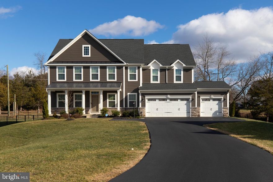 Welcome to this beautifully designed 3-level NVR home, built in 2022 and ideally situated on a quiet cul-de-sac. With an open-concept layout, upgraded finishes throughout, and a west/southwest-facing orientation that fills the home with natural light, this property offers the benefit of newer construction without the new-construction price tag—and the peace of mind of low maintenance for years ahead.

The main living area showcases a bright, open layout anchored by a gourmet kitchen featuring quartz countertops, stainless steel appliances, a custom tile backsplash, and a butler’s pantry. These high-end finishes flow seamlessly into the dining and living spaces, creating an ideal environment for everyday living and entertaining. A versatile room on this level can serve as a main-level bedroom or dedicated office. From here, step out to a screened-in porch overlooking the mostly flat, usable backyard—perfect for relaxing, dining, and enjoying the outdoors. A spacious 3-car front loading garage provides exceptional convenience and storage.

Upstairs, you’ll find four generously sized bedrooms along with a flexible loft space at the top of the stairs—ideal for a home office, playroom, lounge, or easily converted into a fifth bedroom. The thoughtful layout emphasizes versatility, comfort, and convenience.

The fully finished walkout basement offers even more living space, including a large recreation room, a dedicated theatre room, and a separate room currently used as a workout area. A full bathroom on this level makes it perfect for guests or multi-generational living, and the walkout design allows for natural light and direct access to the backyard.

This is a rare opportunity to own a nearly new home where every major system and feature is only a few years old—offering modern style, functional living spaces, and minimal maintenance for the next 15 years. Beautifully upgraded and move-in ready, this home is an exceptional find.