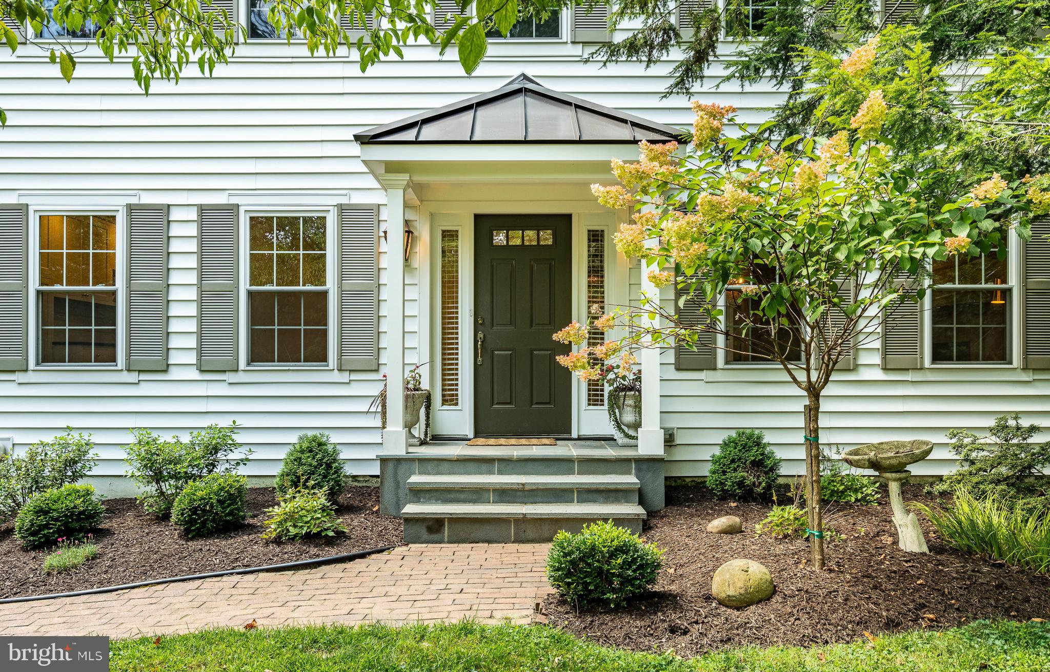 OPEN HOUSE Sunday, Aug. 10th, 1:00-3:00PM. Amazing property on 1.9 private, wooded acres north of West Chester Boro, 1032 N New St is a beautifully renovated home blending modern design with a natural setting. Enjoy abundant natural light through walls of windows and a large back deck that embraces the serene surroundings. This professionally designed open-concept floor plan features custom wood doors, hickory flooring, a wood stove with herringbone tile, exposed beams, and glass pocket doors. The chef's kitchen boasts a large center island, quartz countertops, a farmhouse sink, and custom inset cabinets, complemented by a butler's pantry with soapstone counters and a beverage fridge. Discover a moody den with a fireplace and built-in walnut bench, alongside an exquisitely finished mudroom with laundry and a powder room. Upstairs, a new addition includes 5 bedrooms and 3 full baths, all designed in natural hues with decorative tile and pristine views. The exterior features new siding and roof, bluestone steps, and cascading greenery, hydrangeas, azaleas, and rose bushes. Enjoy the wooded playground with a fire pit, two storage sheds, and a spacious back lawn. Located in W Goshen Twp, you're minutes from West Chester Boro shops and dining, and East Bradford Park, with convenient access to Rte 202. This meticulously designed home is a rare find in a peaceful oasis – visit today, make an offer and call it home. Available immediately.