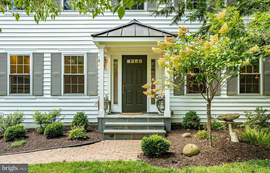 Amazing property on 1.9 private, wooded acres north of West Chester Boro, 1032 N New St is a beautifully renovated home blending modern design with a natural setting. Enjoy abundant natural light through walls of windows and a large back deck that embraces the serene surroundings. This professionally designed open-concept floor plan features custom wood doors, hickory flooring, a wood stove with herringbone tile, exposed beams, and glass pocket doors. The chef's kitchen boasts a large center island, quartz countertops, a farmhouse sink, and custom inset cabinets, complemented by a butler's pantry with soapstone counters and a beverage fridge. Discover a moody den with a fireplace and built-in walnut bench, alongside an exquisitely finished mudroom with laundry and a powder room. Upstairs, a new addition includes 5 bedrooms and 3 full baths, all designed in natural hues with decorative tile and pristine views. The exterior features new siding and roof, bluestone steps, and cascading greenery, hydrangeas, azaleas, and rose bushes. Enjoy the wooded playground with a fire pit, two storage sheds, and a spacious back lawn. Located in W Goshen Twp, you're minutes from West Chester Boro shops and dining, and East Bradford Park, with convenient access to Rte 202. This meticulously designed home is a rare find in a peaceful oasis – visit today, make an offer and call it home. Available immediately.