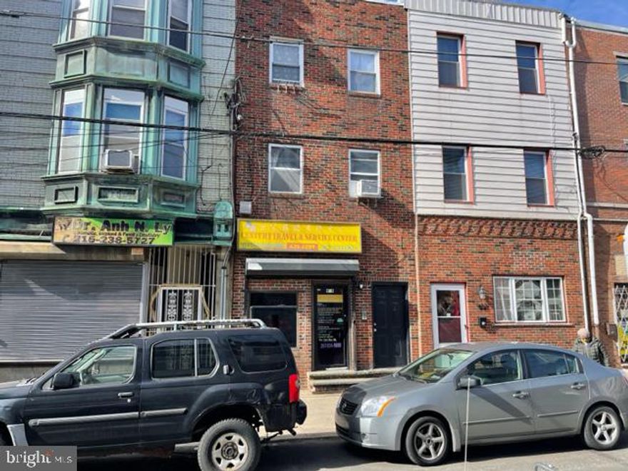 Italian market area, Investment property  store front and two family dwelling.
First floor used as an office. Travel agency.
All separate utilities, Second floor large apartment one bedroom, modern bath and kitchen. 
Third floor one bedroom, modern bath and kitchen.
