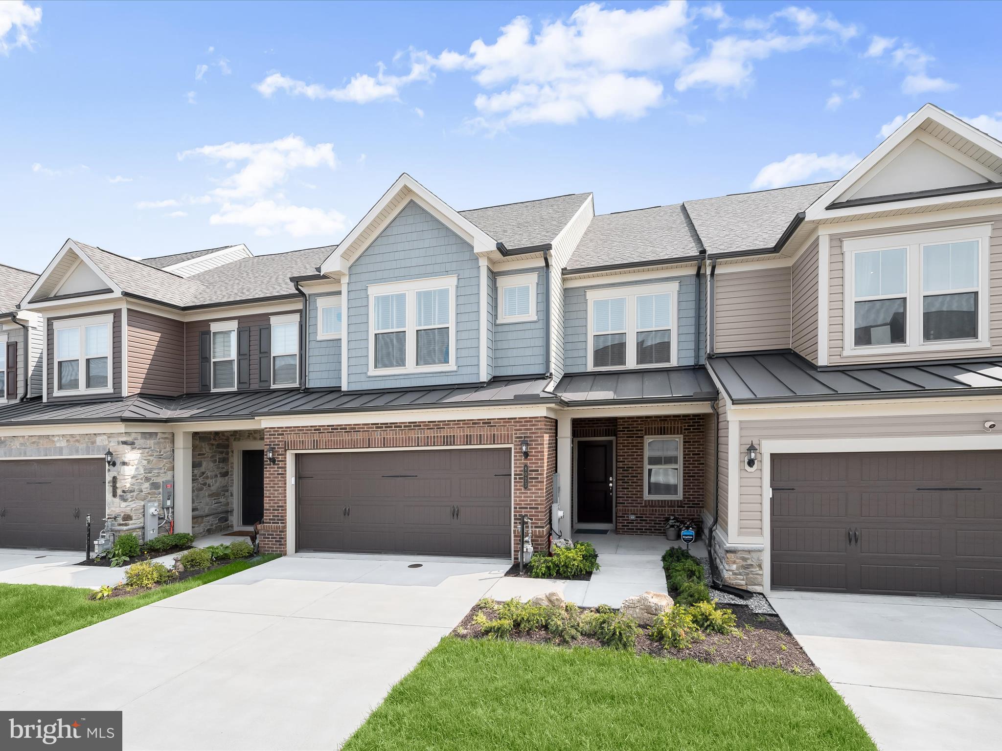 Welcome home to 8023 Jennys Way located in The Villas at Maple Lawn, Howard County’s premiere 55+ community! This absolutely stunning Branton model built in 2023 by Pulte homes is overflowing with designer upgrades and finishes. Luxury meets functionality on the main level where everything including the owner’s suite is conveniently located for daily living. Soaring ceilings and wide-plank luxury vinyl plank flooring set a sophisticated tone throughout. A private office is adorned with custom trim work and seamlessly leads to a spacious dining area, elegant living room, and a gourmet open-concept kitchen. The kitchen is a chef’s dream equipped with Kitchen-Aid appliances, quartz countertops, a stainless steel farm sink, and stylish grey shaker-style cabinets. A striking fireplace with floor-to-ceiling black slate tile creates a dramatic focal point at the heart of the home. The sunroom offers a serene retreat with a wall of windows and custom window coverings. The primary bedroom is a sanctuary with two spacious walk-in closets. The primary bathroom features a dual sink vanity with quartz countertops and a luxurious shower stall. The main level also provides a mud room, welcome center, laundry room, and half bath. Upstairs you’ll find an inviting loft space which easily doubles as a second living room, two generously sized bedrooms, and a full bathroom with dual sink vanity. A large utility room offers ample room for storage. Ideally located close to all major Baltimore/DC commuter routes and with all of the delectable dining and shopping offerings of the prestigious Maple Lawn community right across the street, you won’t need to search any further for the perfect 55+ destination.