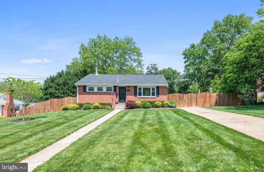 Turnkey and move in ready in the Virginia Hills neighborhood of Alexandria, this four bedroom, three full bath raised ranch style home truly checks all of  the boxes. Beautifully renovated and situated on a large, 0.23 acre fully fenced lot, this fully updated home blends the perfect mix of indoor and outdoor living. Gleaming wood floors flow throughout the main level, featuring a bright living space anchored by a large picture window, a dining space with sliding glass doors leading to the expansive brick patio and a crisp, all white kitchen highlighted by granite counters and stainless appliances. A large main level primary suite has two customized closets and a spa-like attached bath with dual vanity and large glass shower. A second spacious bedroom and renovated full hall bathroom complete this level. The fully finished lower level is home to a spacious yet cozy family room, two additional bedrooms and a third updated full bathroom. A separate laundry room and a large utility and storage room complete the walk out lower level with direct access to the expansive rear yard. Recent updates include new HVAC, a new hot water heater and fresh exterior painting. Don’t miss the expansive floored attic space with generous storage. This special offering is centrally located, offering an easy commute to Old Town Alexandria, the Pentagon, Fort Belvoir and more - all that’s left to do is move in! Welcome home!