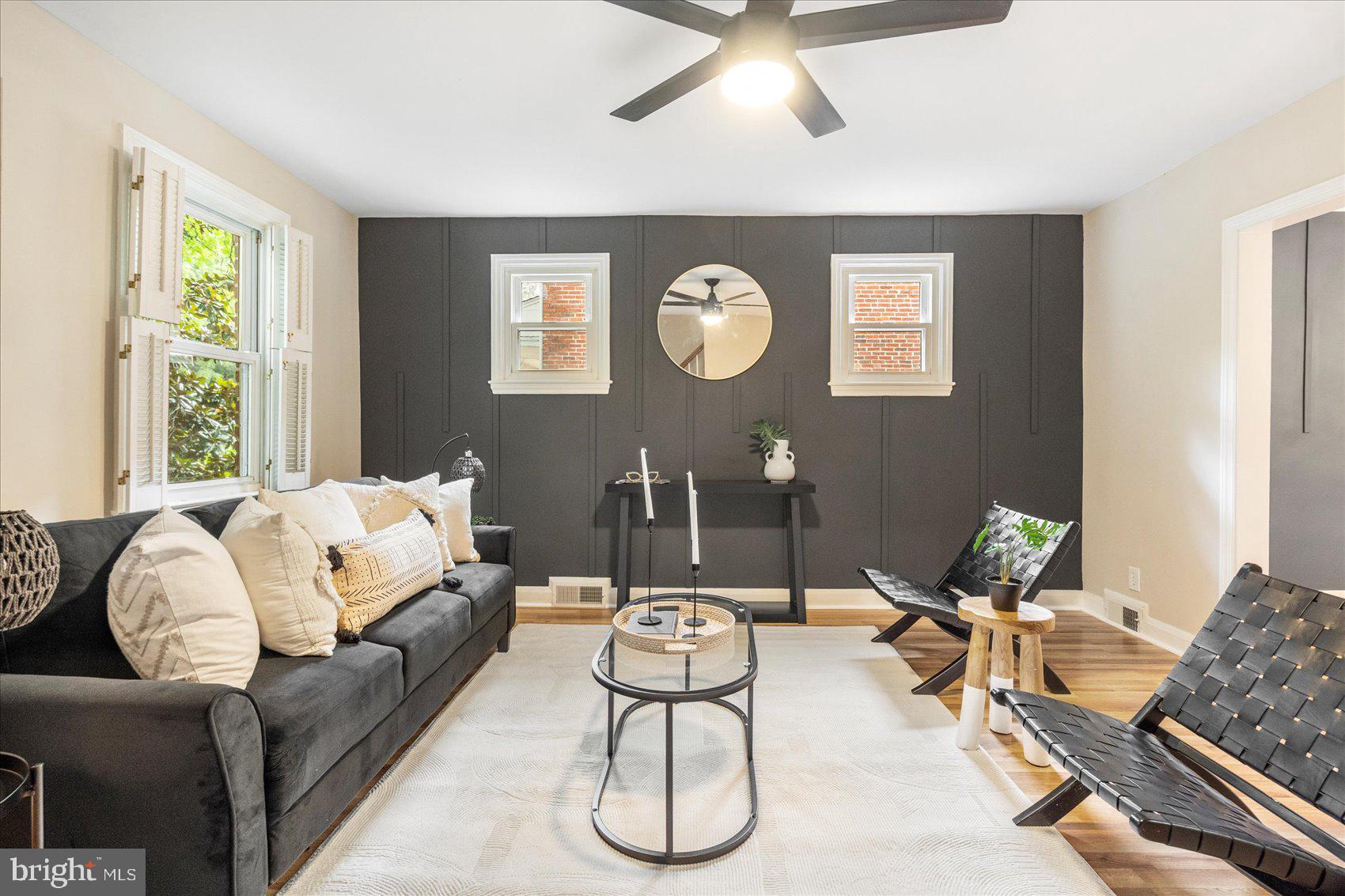 Beautifully remodeled 3BR/2BA brick Townhome located on a tree-lined street in the quiet neighborhood of Parkside. Make your way past a large shade tree as you step up to the covered front porch of your forever home. Step inside to a home filled with natural light, a soft color palette, easy care flooring, and accent walls throughout. The living room is spacious with a custom feature wall, the dining room is large with a custom feature wall, and the kitchen is spectacular. The kitchen offers plenty of cabinets, stainless steel appliances including a slide in gas range, granite countertops with a complimenting tiled backsplash, and a deep stainless sink. On the second floor are two sizable secondary bedrooms, a large primary bedroom with a custom feature wall, and a beautifully tiled full bath. The lower level offers additional living space featuring a possible fourth bedroom, a full bath with a walk-in shower, a large family room, laundry, storage, and a walk-out to the yard. From the kitchen step into an enclosed porch with access to the fenced yard offering tons of green space, a large shade tree and so many possibilities. This home is move-in ready with so much to offer new homeowners, and is located in close proximity to shopping, restaurants, and commuter routes.