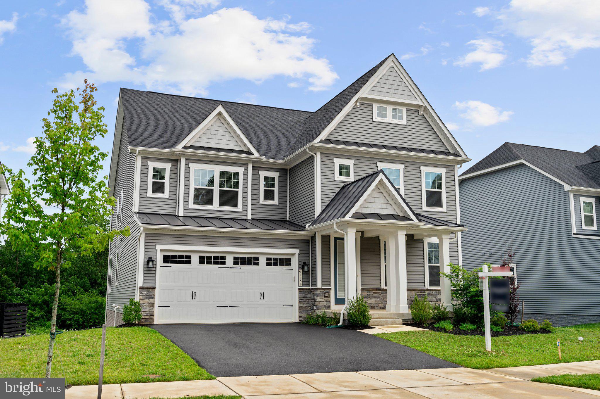Stunning Tyler Colonial by NVHomes, located in the desirable Maple Lawn South community. Rich in comfort and style, this home offers over 5,000 sq. ft. of luxurious living space with an open floor plan, and custom upgrades throughout.
Enter the sun filled foyer to a design inspired interior, with modern wide plank summer field Oak hardwood flooring. Comfort comes easy in the bright and airy open concept living area that includes a sitting room, family room, gourmet kitchen, formal dining room, and dinette. Your family will love this open concept home.
The kitchen has gorgeous Frost white quartz countertops, with grey Glass Mosaic backsplash, and Upgraded GE Stainless Steel Appliances. Built-in Microwave, Gas Cooktop, GE interior dishwasher and Built in Convection Double wall oven, and side by side 25.3 cu. ft. Refrigerator, The kitchen island has a breakfast bar and upgraded sink and kitchen faucet. . The kitchen also has a walk-in pantry and upgraded cabinets.
The staircase leads to a spacious loft, and primary suite, and offers two walk-in closets, and luxury upgraded en suite bath with a soaking tub, frameless shower, and dual quartz vanities.
Bedrooms 2 & 3 are Adjoined by a dual entry full bath, are two sizable bedrooms, and a fourth bedroom suite with its own private bathroom, all with walk-in closets.
Brand new carpet throughout the lower level that provides a large recreation room There’s a game room, and room that can be used as a media room, and full bathroom with stand up shower. The basement walks out to the backyard.
Maple Lawn South offers an extensive list of amenities that include a clubhouse, an in-ground swimming pool, and tot lots. Shopping, dining, and entertainment are all located in your backyard. Nearby commuter routes MD-216, US-29, MD-32 and I- 95 provide easy access to all surrounding areas.