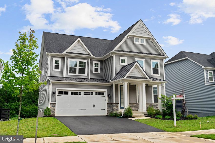 Stunning Tyler Colonial by NVHomes, located in the desirable Maple Lawn South community. Rich in comfort and style, this home offers over 5,000 sq. ft. of luxurious living space with an open floor plan, and custom upgrades throughout.

Enter the sun filled foyer to a design inspired interior, with modern wide plank summer field Oak hardwood flooring. Comfort comes easy in the bright and airy open concept living area that includes a sitting room, family room, gourmet kitchen, formal dining room, and dinette.  Your family will love this open concept home.

The kitchen has gorgeous Frost white quartz countertops, with grey Glass Mosaic backsplash, and Upgraded GE Stainless Steel Appliances.  Built-in Microwave, Gas Cooktop, GE interior dishwasher and Built in Convection Double wall oven, and side by side 25.3 cu. ft. Refrigerator,  The kitchen island has a breakfast bar and upgraded sink and kitchen faucet. .  The kitchen also has a walk-in pantry and upgraded cabinets.

The staircase leads to a spacious loft, and primary suite, and offers two walk-in closets, and luxury upgraded en suite bath with a soaking tub, frameless shower, and dual quartz vanities.

Bedrooms 2 & 3 are Adjoined by a dual entry full bath, are two sizable bedrooms, and a fourth bedroom suite with its own private bathroom, all with walk-in closets.

 Brand new carpet throughout the lower level that provides a large recreation room  There’s a game room, and room that can be used as a media room, and full bathroom with stand up shower.  The basement walks out to the backyard.

Maple Lawn South offers an extensive list of amenities that include a clubhouse, an in-ground swimming pool, and tot lots. Shopping, dining, and entertainment are all located in your backyard. Nearby commuter routes MD-216, US-29, MD-32 and I- 95 provide easy access to all surrounding areas.