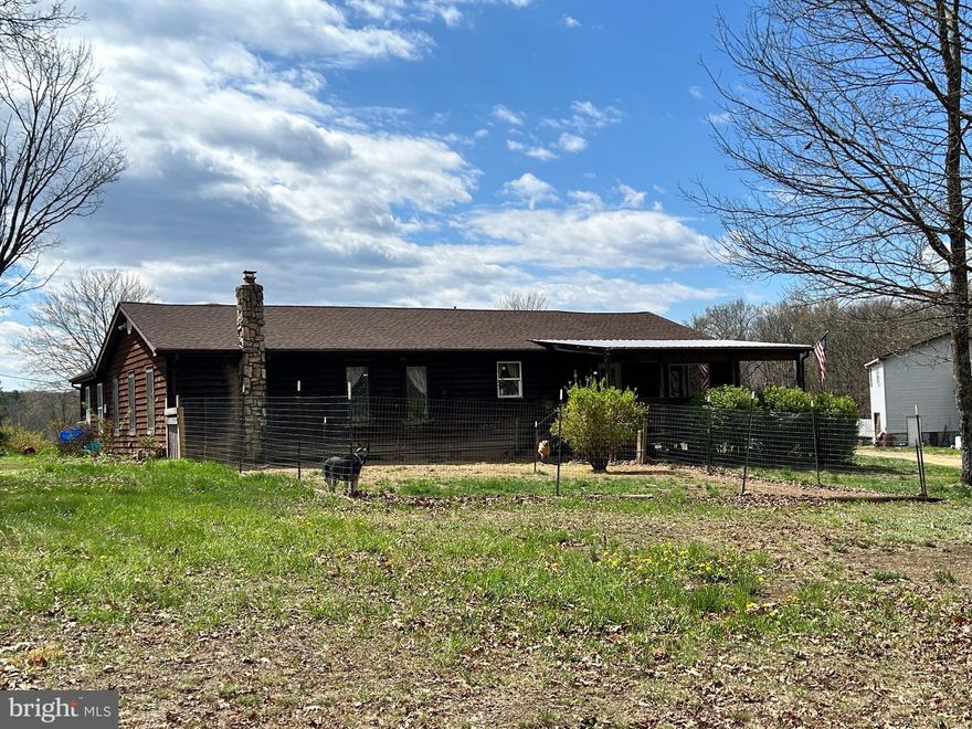 Escape to wide-open space and peaceful country living with this charming ranch-style home set on 6.5 beautiful acres. Tucked away in a truly serene rural setting, this property offers the kind of privacy and quiet that’s hard to find—yet still delivers the flexibility to fit just about any lifestyle. Currently operating as a farm, the land is well-suited for a variety of uses, whether you're looking to continue agricultural pursuits, create a private retreat, or build out your dream homestead. With plenty of room to roam, it’s an ideal setup for horses, livestock, or simply enjoying the outdoors. One of the standout features is the impressive raised detached garage—designed with serious functionality in mind. With enough space to accommodate a vehicle lift, it’s perfect for car enthusiasts, hobbyists, or anyone needing a versatile workshop. Above the garage, you’ll find a fully move-in-ready apartment complete with its own electric meter and septic system. This separate living space opens the door to endless possibilities—use it as a guest house, in-law suite, or generate income as a rental. Properties like this don’t come around often. Whether you're chasing space, versatility, or a peaceful lifestyle, this one delivers. Just a few miles outside of Winchester. Come experience everything this unique ranch has to offer—schedule your showing and see it for yourself.  Please no drive-byes. Not safe. Owner needs to put animals away for scheduled showings.