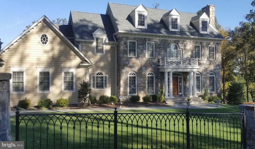 2034  Rockingham Street is a home that will delight and satisfy those looking for true quality in addition to detailing found in custom construction.   You won't see this house "down the street."  A Georgian style Colonial   that exemplifies  unsurpassed design and high-end finishes  in each and every room.  Lets start with the beautiful  Stone exterior and welcoming  foyer highlighted by  a solid wood custom entry door with transoms, wide solid oak hard wood flooring is found on the main and upper levels, intricate plaster moldings and  Palladian windows are some of the architectural features that make up 2034 Rockingham.  10 foot ceilings, 4 gas fireplaces, and an elevator to all levels are just a few of the amenities that living in a Sagatov built home one relishes.   The gourmet kitchen is outfitted  with English Furniture quality cabinets, a Wolf  6- burner cooktop and custom vent  hood, Sub Zero Refrigerator plus 2 "drawer" refrigerators, 2 Bosch dishwashers,  a wine captain, a center island "prep" sink. and additional cabinetry in the casual dining area.  It is all here for the   Gourmet Chef.   Working from home in the  finely crafted Cherry library is enviable. The  primary bedroom suite  transcends the ordinary with  two separate walk -in closets, a large spa bath with separate shower and tub. Posh secondary bedrooms all with  en suite bathrooms complete the upper level. Venture to the lower level and you will find a media/billiard room with French doors that walk out to a custom patio with firepit.  Come back inside and have a seat at the  custom Cherry wet bar complete with wine captain, under counter refrigerator, microwave and best of all the leathered  granite counter top...it is stunning.  The wine room is ever so attractive.  An additional bedroom(s) and full bath plus a a half bath accommodations are also on this level.  Returning to the outside there is an upper level flagstone  patio with built-in grill and a free standing Stone  Fireplace for the epitome of outside entertaining.   If you are seeking a masterfully crafted Traditional home you must come see this one.  It is truly like-new and richly appointed with the finest of materials.