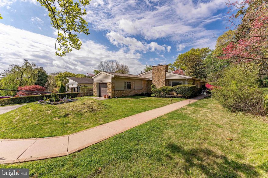 Welcome to 266 Tomkenn Road, a 3-bedroom, 2-bath single-family ranch home located in the highly desirable Wynnewood area. As you approach, a four-car driveway and one-car garage provide ample parking and convenience. Inside, the living room features oak hardwood floors and a wood-burning fireplace. The adjacent office includes carpet flooring and a closet, making it ideal for working from home or additional living space. The dining room offers hardwood floors, a storage closet with shelving, and newly replaced windows that bring in natural light. The kitchen includes tile flooring, a gas cooktop with range hood, double wall oven, and space for a table or breakfast area. The mudroom adds functionality with tile flooring, a pantry closet, washer and dryer, and access to the garage, backyard, and basement. Down the hall, the bedroom wing includes a bedroom with hardwood floors and a closet, along with a full hall bathroom featuring tile flooring, a double sink vanity, and a tub and shower combination. Another bedroom offers carpet flooring, a mirrored double closet, and a built-in desk. The primary suite includes carpet flooring, a chandelier, a walk-in closet, a linen closet, and built-in storage for a television. The en-suite bathroom features tile flooring, wall sconces, a single sink vanity, and a step-in shower. The lower level expands the living space with a family room featuring tile flooring, a storage closet, and access to the utility room, which includes a sink, refrigerator, and the home’s systems. A separate studio space with a closet offers flexibility for a home gym, playroom, or additional workspace. Conveniently located near Penn Wynne Park, Wynnewood Valley Park, and the shopping and dining along City Avenue, this home offers both comfort and accessibility. Don’t miss the opportunity to make 266 Tomkenn Road your new home.