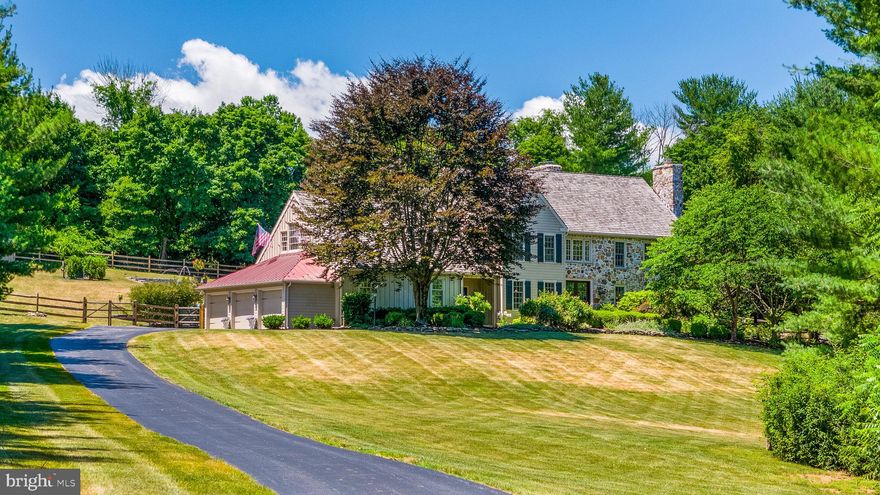 Welcome to our Chester County inspired colonial farmhouse nestled on 2 acres in Chester Springs, where luxury meets countryside charm. This meticulously designed home boast a gourmet french country kitchen, featuring a Subzero refrigerator, six burner Wolf Range, Bosch dishwasher, and an expansive oversized island – perfect for culinary enthusiast and entertaining alike.  Step inside four bedrooms and 3 1/2 baths, adorned with newly installed custom designer lighting throughout. The oversize garage, a rarity in the neighborhood, accommodates up to six cars, ensuring ample space for vehicles and storage. Outside, a new 20‘ x 40‘ pool with a spacious patio,  heater and deck jets awaits, complemented by professional landscaping and a new split rail fence that ensures privacy and breathtaking views from every angle. A newly installed double hung Pella front door welcomes you into this Chester County masterpiece, merging timeless craftsmanship with modern elegance. The home’s classic design enhances the curb appeal of the colonial farmhouse, complementing the Cedar shake roof, natural fieldstone façade, and custom patios.  Inside the foyer two-story expanse bathes the entry with natural light, highlighting the rich finished hardwood floors that flow throughout the main level. This thoughtful addition, not only enhances energy efficiency, but also adds a touch of sophistication, seamlessly integrated with the home’s distinctive character. Whether you’re admiring the panoramic views from the oversize windows or entertaining in the open living areas, every detail of this residence reflects a blend of comfort style and enduring quality  A striking two-story family room with a floor to ceiling fieldstone fireplace, floor to ceiling windows with motorized custom shades, an oversized library/office with built-ins, private patio access, and formal living and dining rooms with a marble surrounded fireplace create an inviting ambience. The open floor plan flows seamlessly, ideal for hosting gatherings. The kitchen delights with custom tile, granite countertops, built-in microwave, wine refrigerator, skylights, oversized sink, and upgraded cubbies added in 2019. Dual staircases lead upstairs to a magnificent master suite, boasting a tray ceiling, hardwood floors, two walk-in closets, and an upgraded designer master bath with double vanity and freestanding soaking tub.  Three additional generously size bedrooms include a princess suite with en suite bath, plus a shared large bathroom with oversized double vanity and water closet with a tub. An upstairs laundry room adds convenience. Recent upgrades, such as thermopane windows, expanded heated and AC garage, newer water heater and updated HVAC systems enhance comfort and efficiency.  There is also an oversized unfinished basement for additional or personalized living space.
Located in Horseshoe Farms, a prestigious, custom built neighborhood that offers the serenity of country living while being minutes away from West Vincent elementary school, the Montgomery, school, major roads, shopping, and dining. Pride of ownership shines throughout, making this colonial farmhouse a perfect blend of luxury, comfort, and tranquility in Chester Springs .
The owner is a licensed PA realtor.