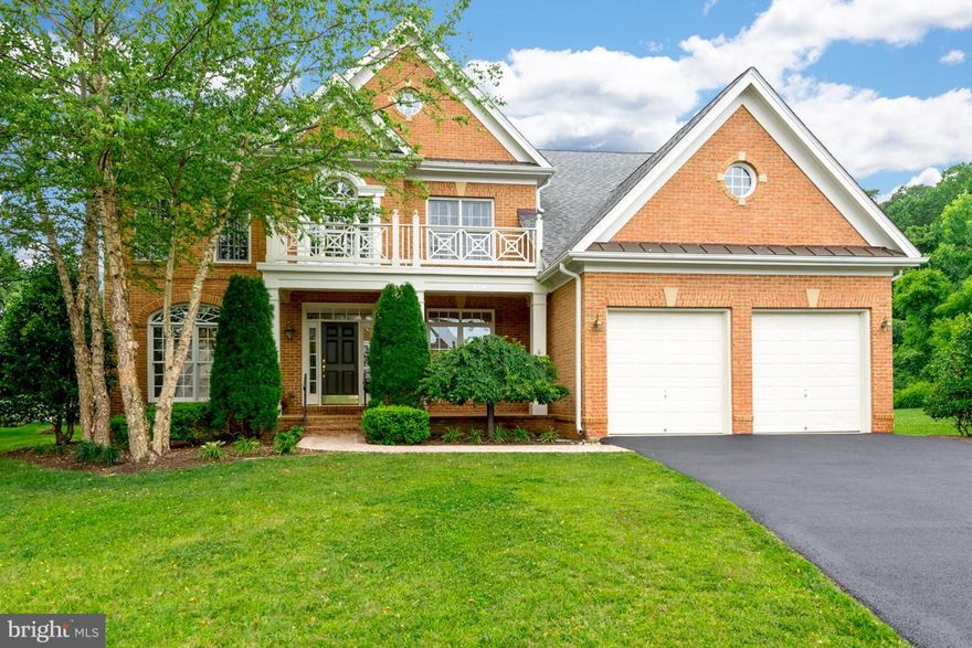 THIS IS A GREAT BUY FOR A HOME OF THIS SIZE,  CONDITION AND LOCATION! This  5 BR, 3 level brick front Manor Home is priced to sell and offers beautiful curb appeal with lush mature landscaping  and sits back on premium private lot!  Wide open sunny, spacious layout is perfect for entertaining with  4.5 BA's, finished lower level w/ 5th BR & full bath, blonde HDWD's in custom Kitchen, 9'ceilings on all 3 levels,1st floor laundry & more! Very large Master Suite with Super Bath. Enjoy the great community amenities such as stunning pavilion and pool, dramatic waterfall at entrance, fishing pier ,tot lot and lots of greenspace to enjoy long walks. Excellent location for commuters and 5 min UBER drive to town.